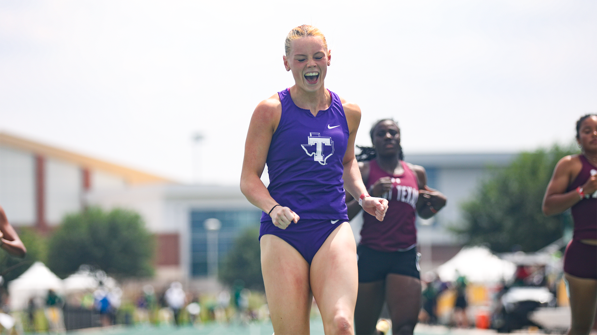 Lauren Roy screaming excitedly after running a top 20 time in the NCAA