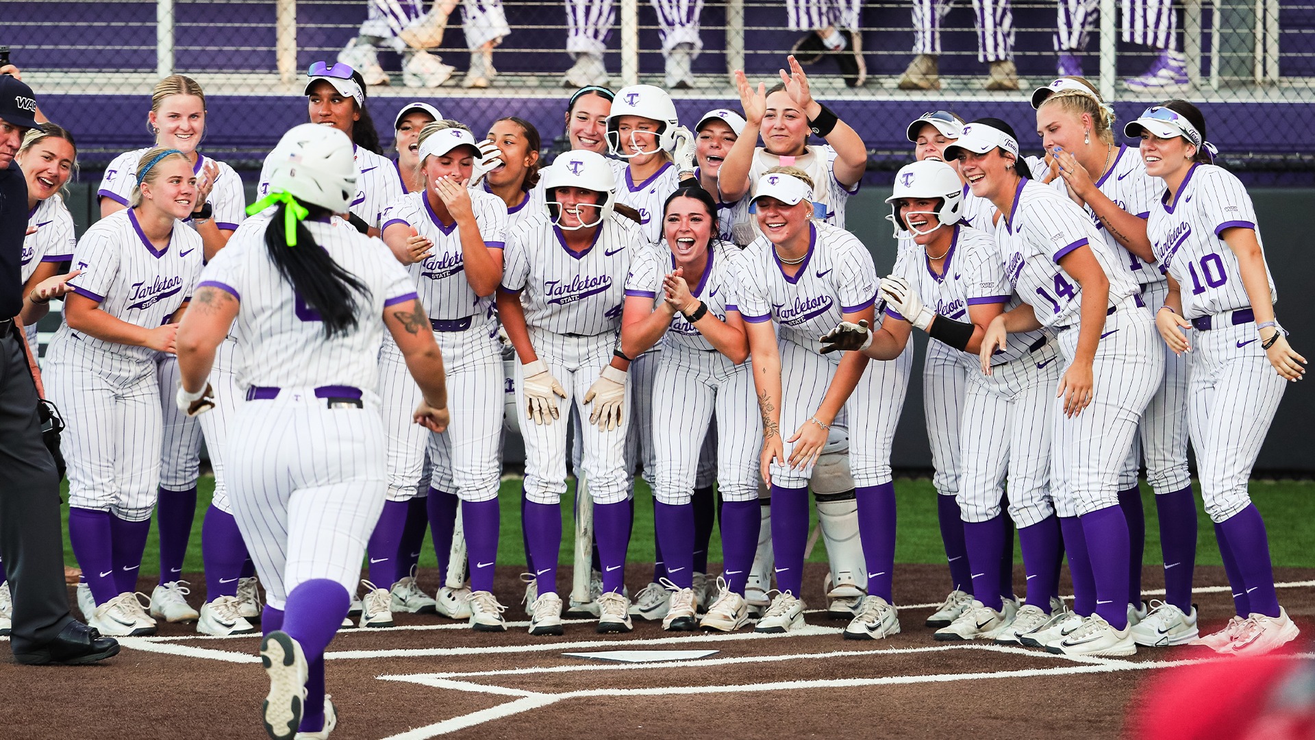 Texan Softball celebrating Braylin Pannill's home run against Utah Tech.
