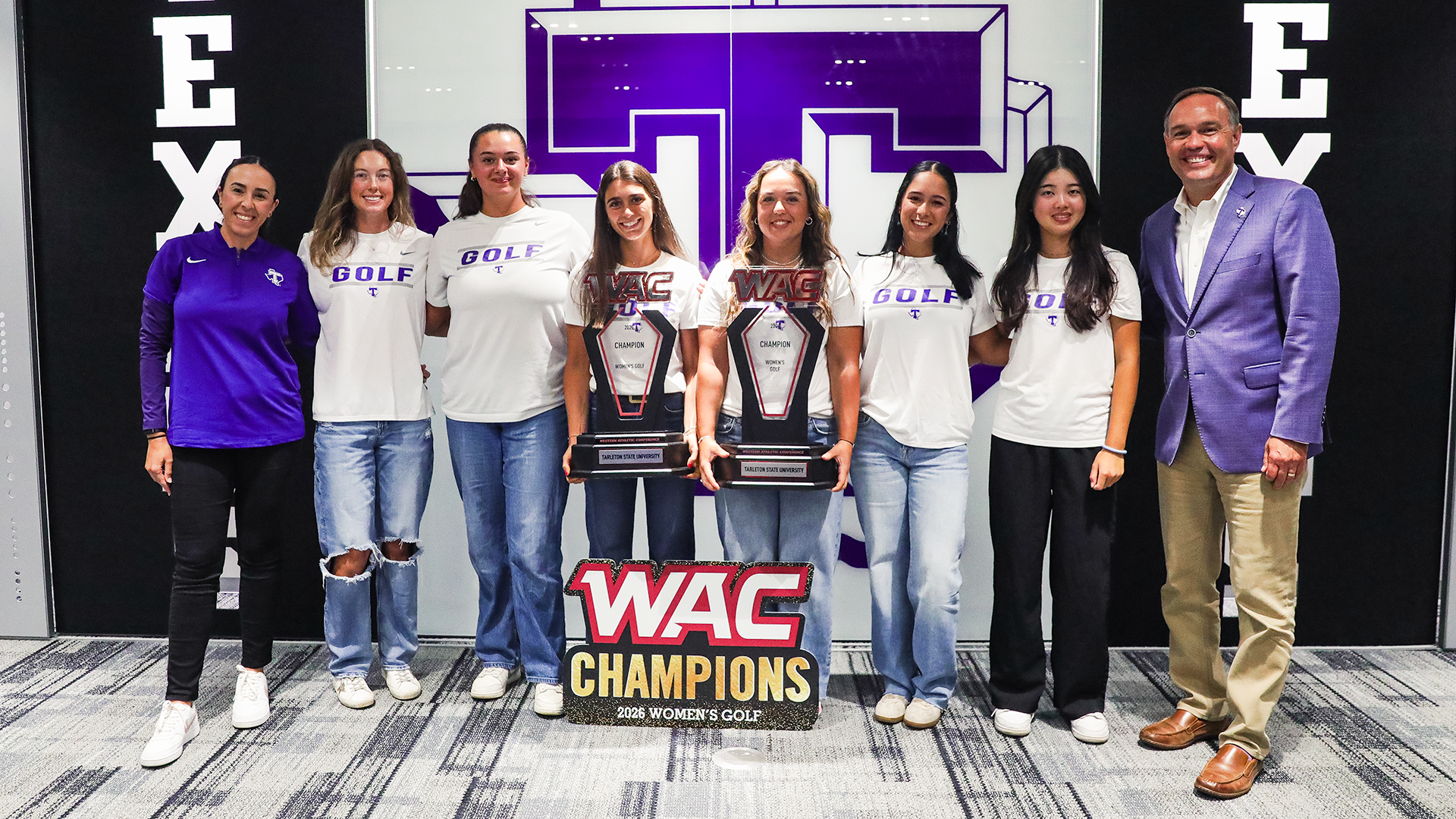 Tarleton State Women's Golf posed photo with trophies