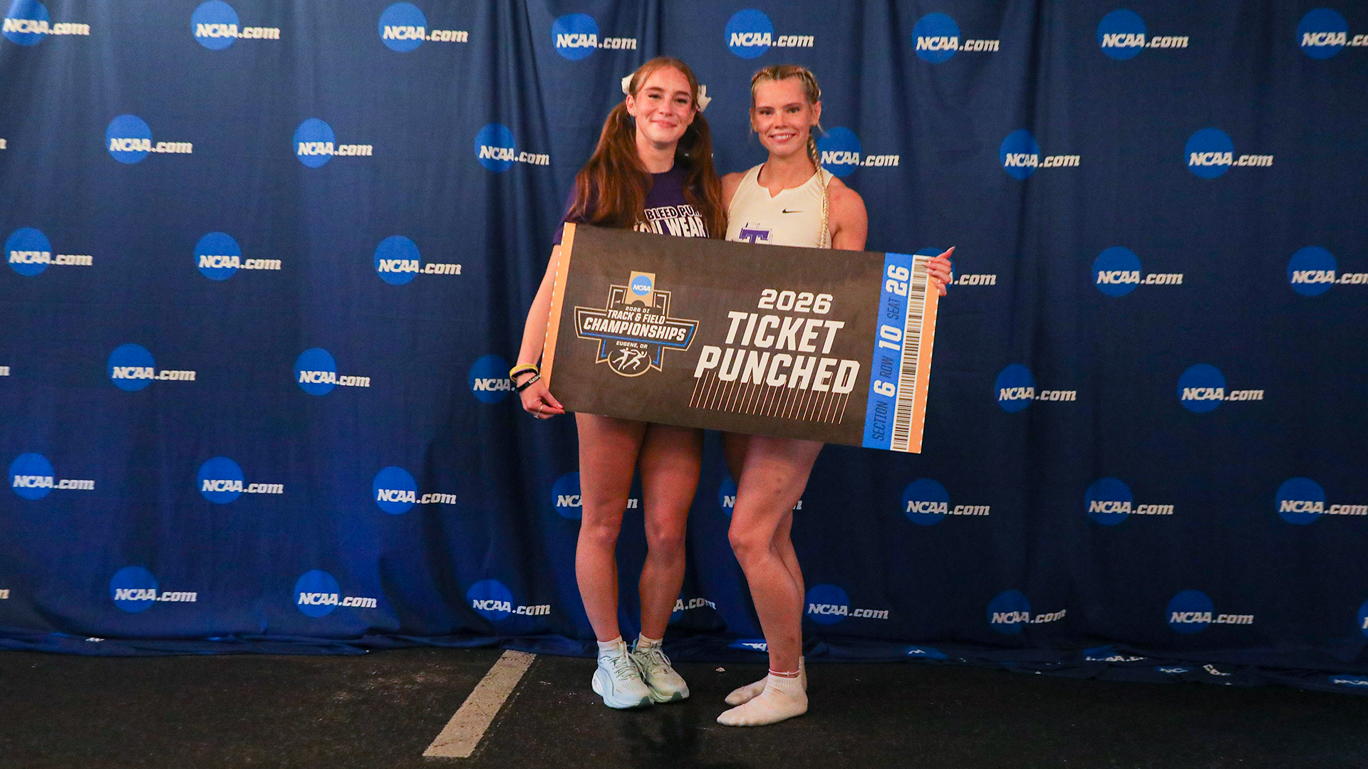 Victoria Cameron, Lauren Roy with the ticket punched sign in Fayetteville, Ark. at the NCAA West First Rounds