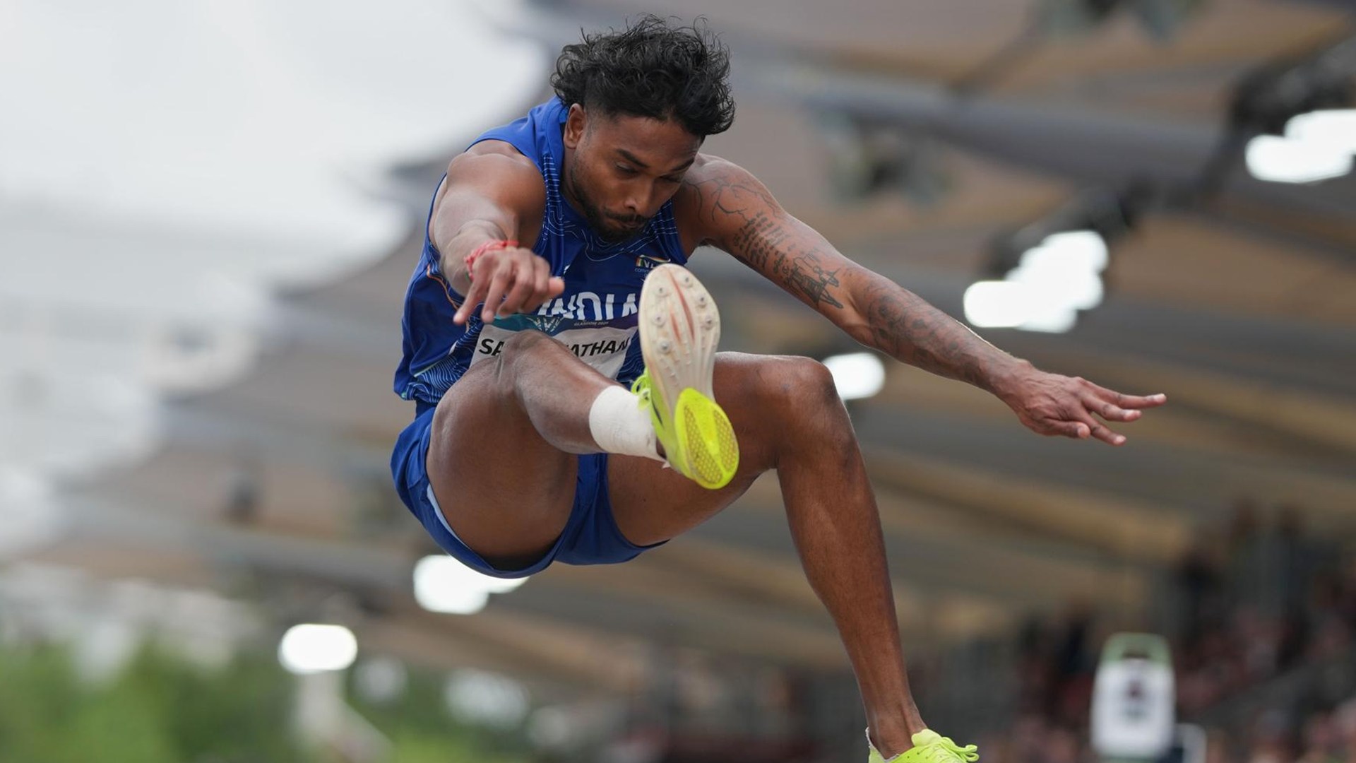Lokesh Sathyanathan jumping for Team India at the Commonwealth Games in Glasgow Scotland