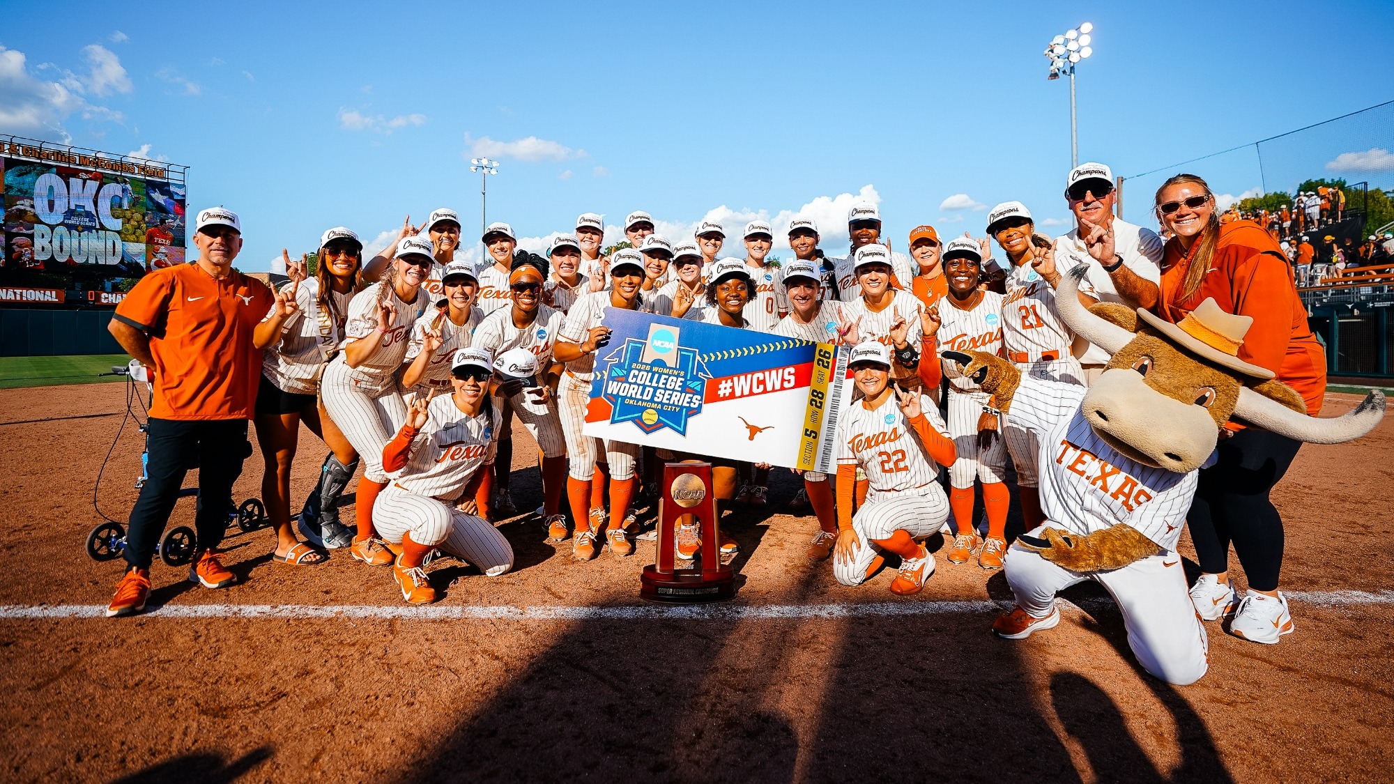 Texas softball celebrates a 5-0 Game 3 shutout of Arizona State to clinch a third straight WCWS