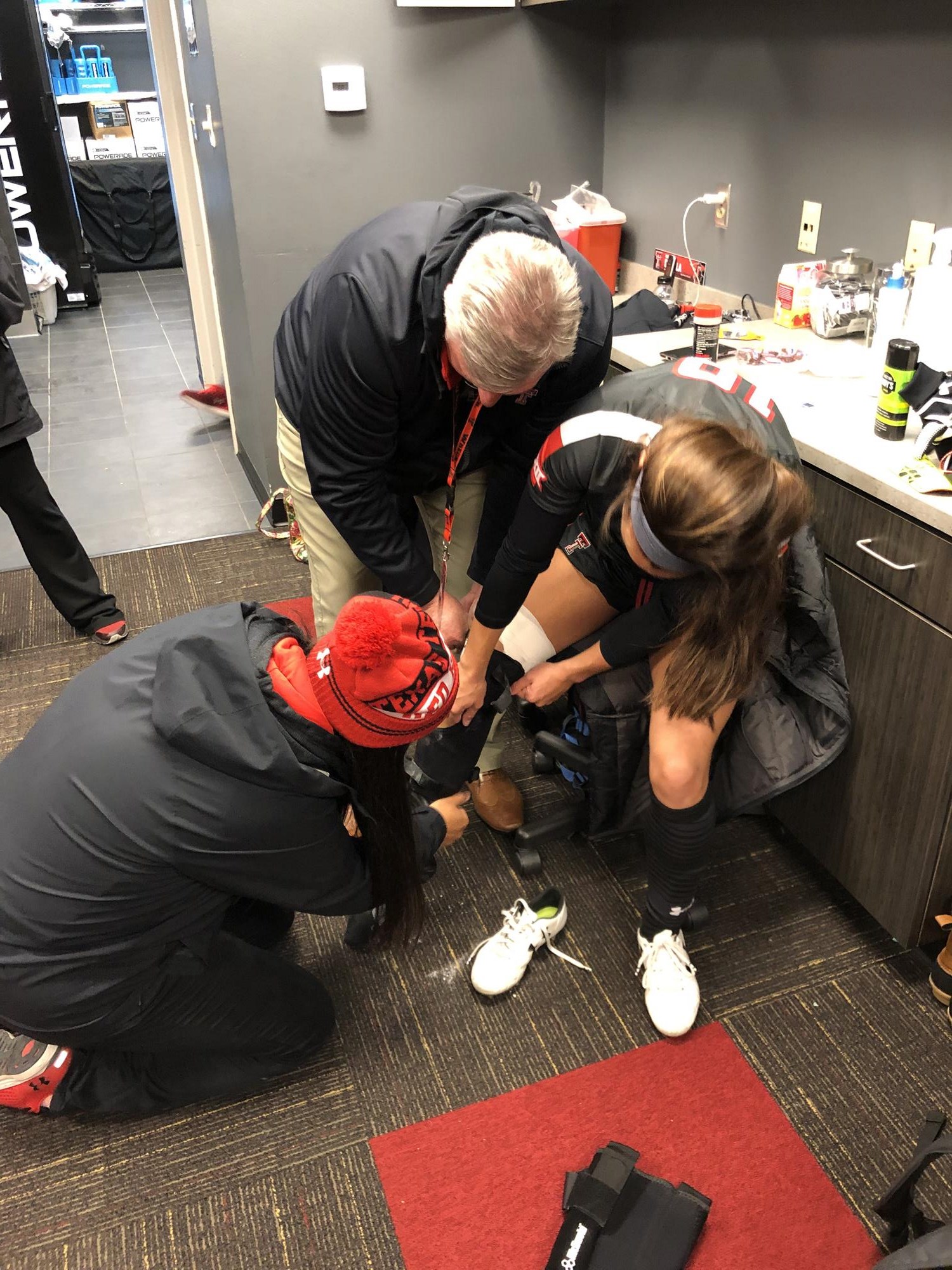 Texas Tech Sports Medicine staff assisting a student-athlete during treatment and rehabilitation.