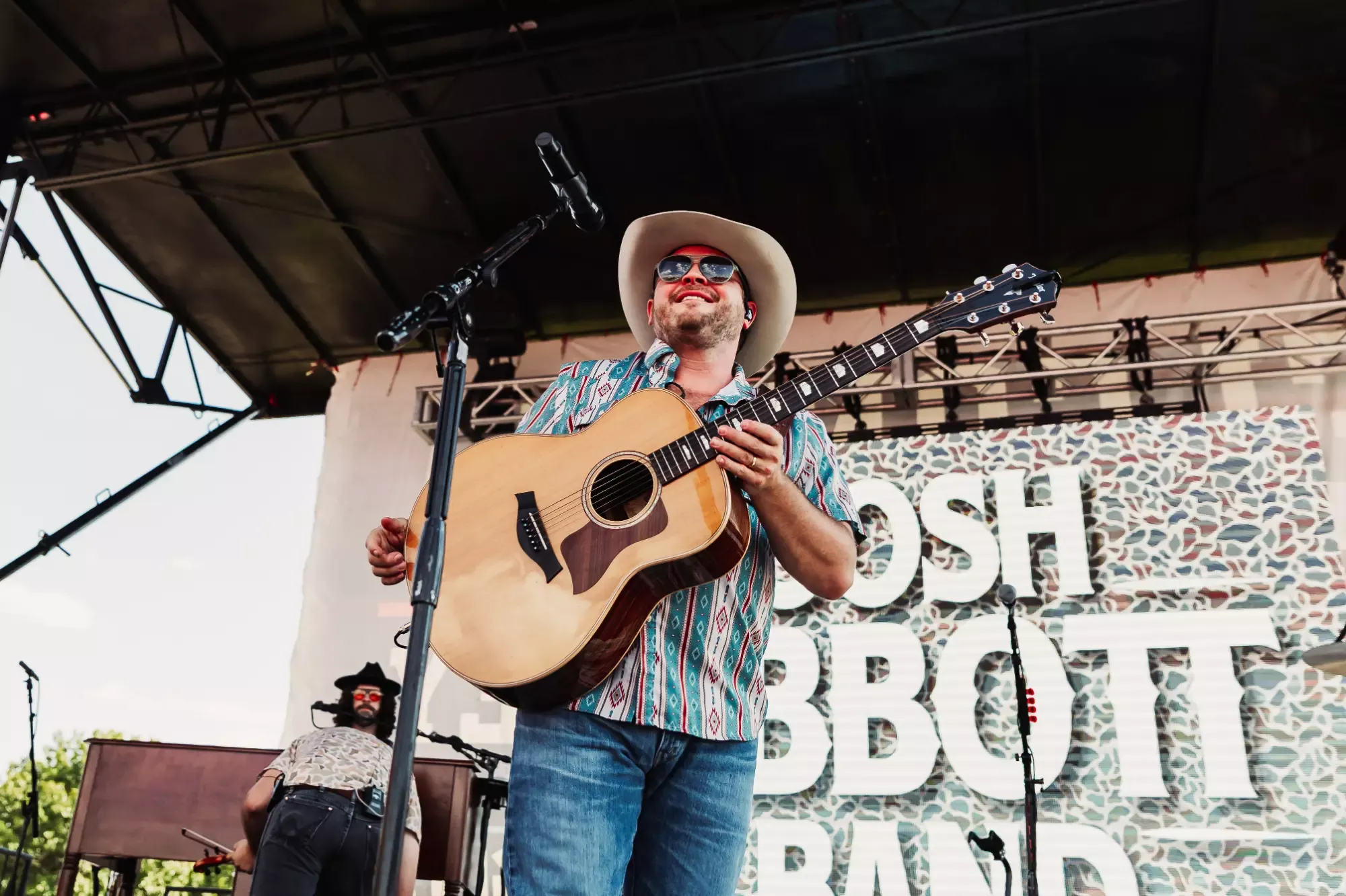 A musician performs onstage during Raider Alley.