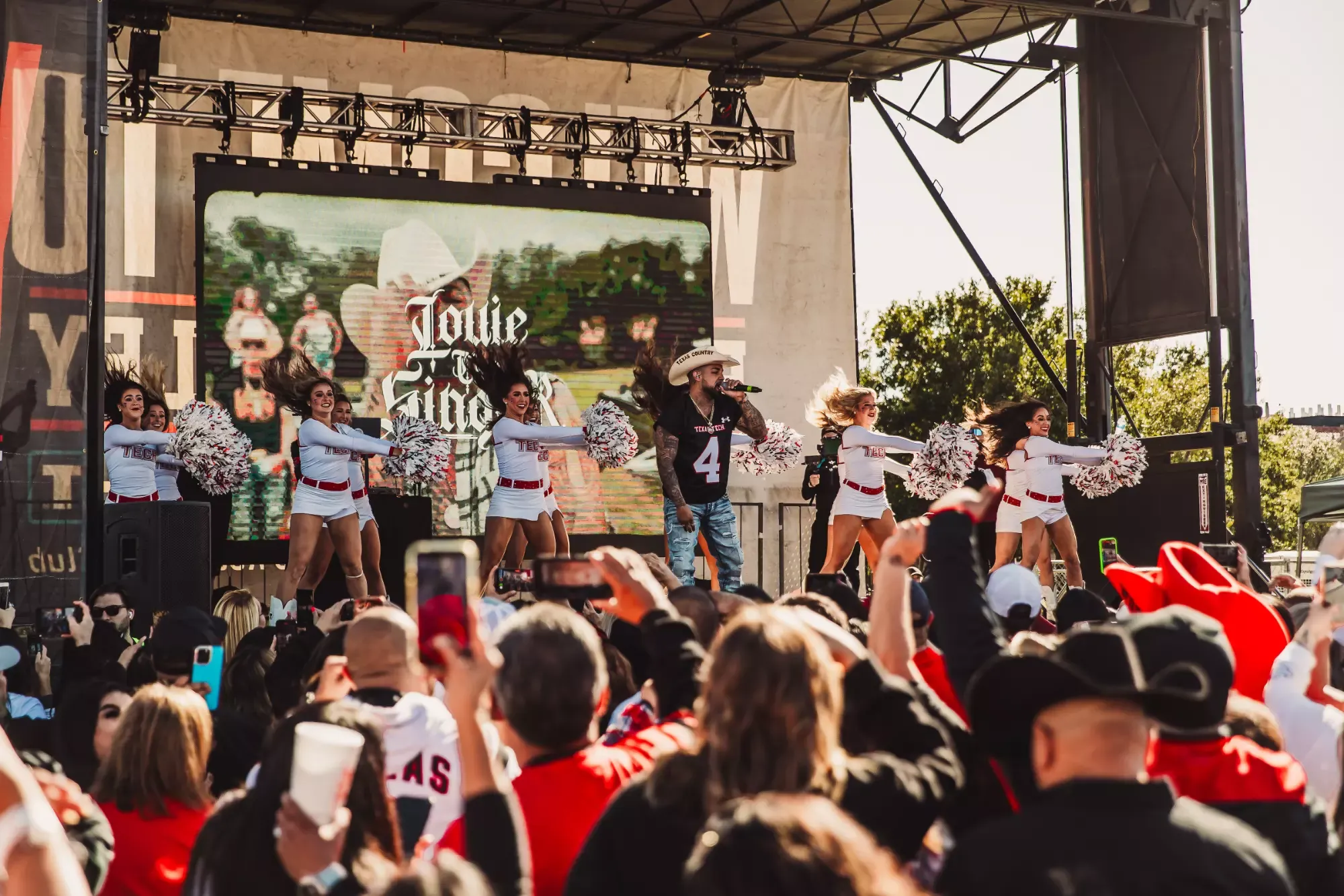 Louie the Singer performs during Raider Alley.