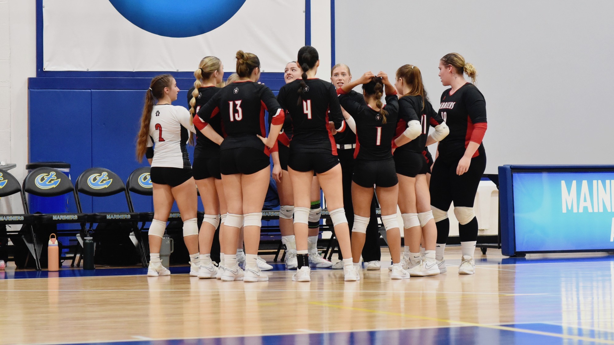 Women's Volleyball Team Huddle