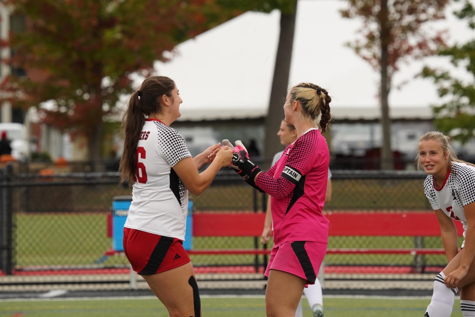 Emily Rock and Amber Fortin Fist Bump