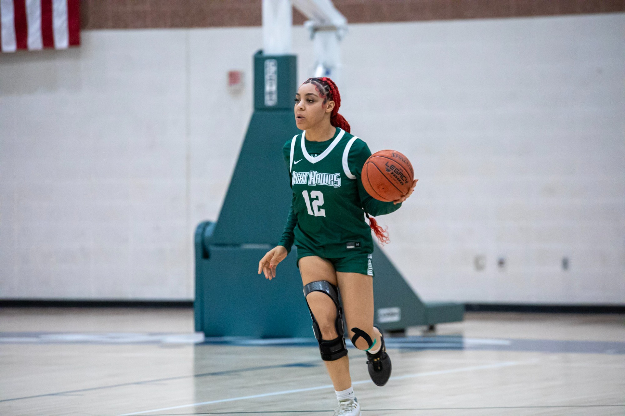 Hill bringing the ball up the court