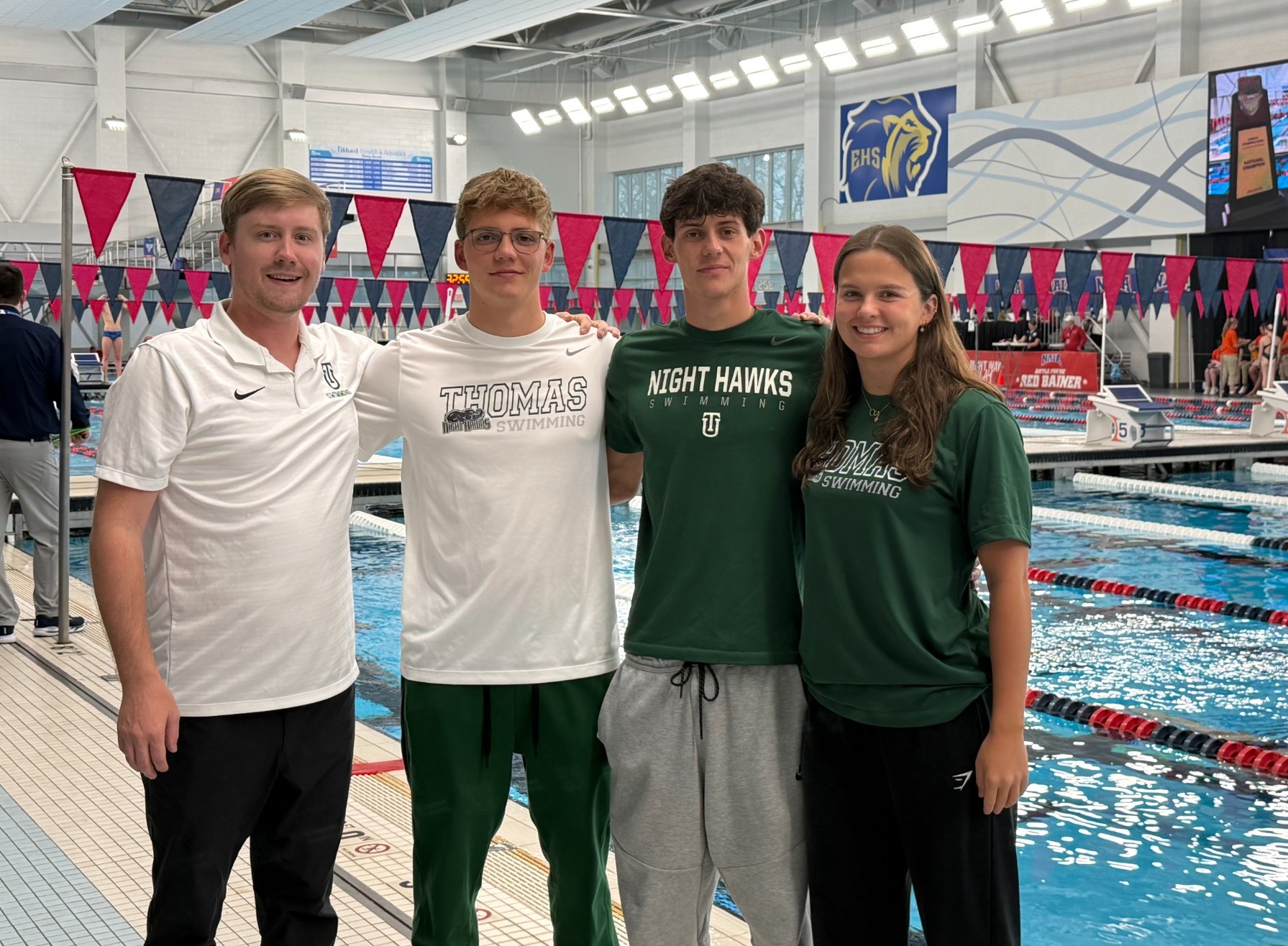 Swimmers and coach at Nationals