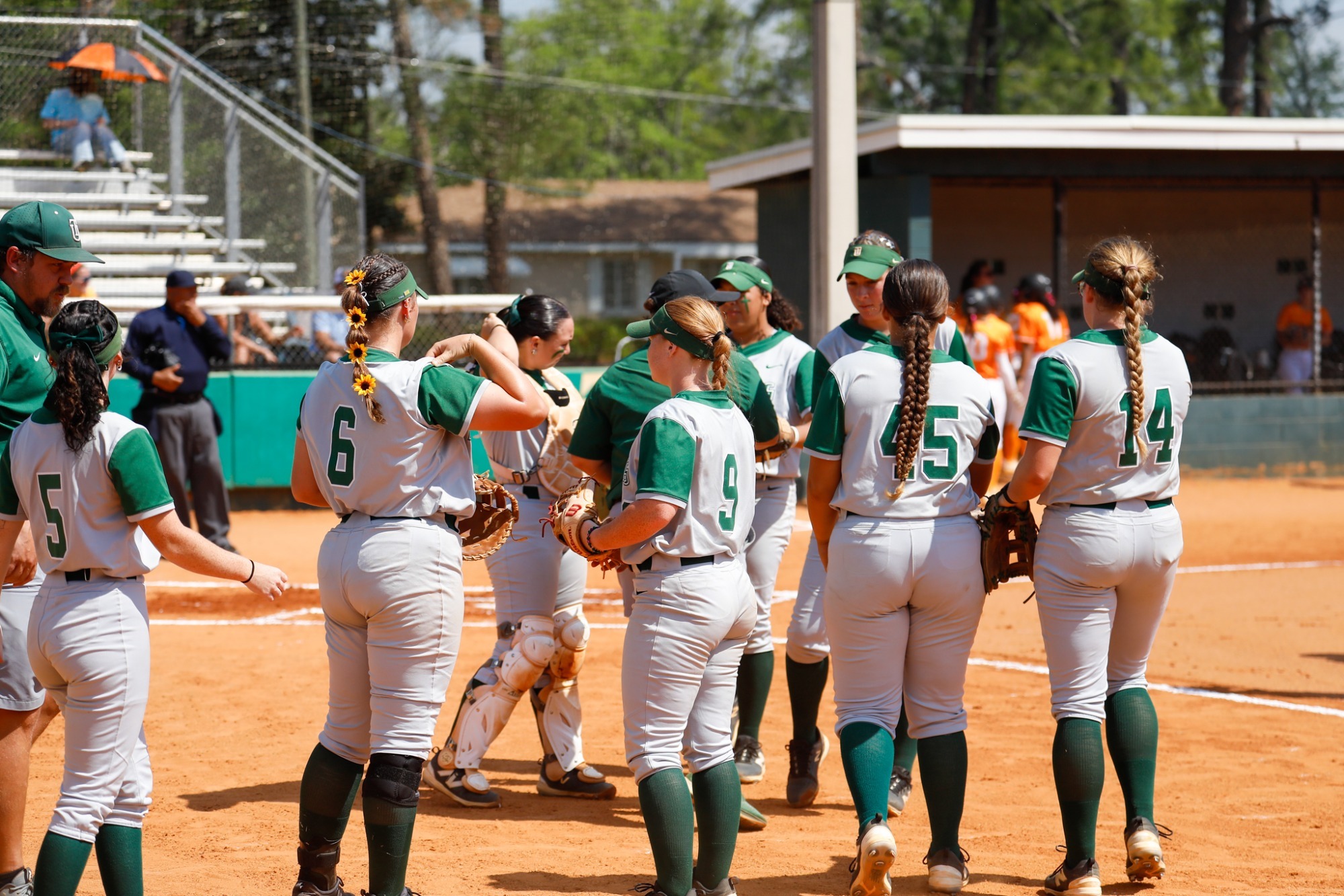 Softball team regroups between innings