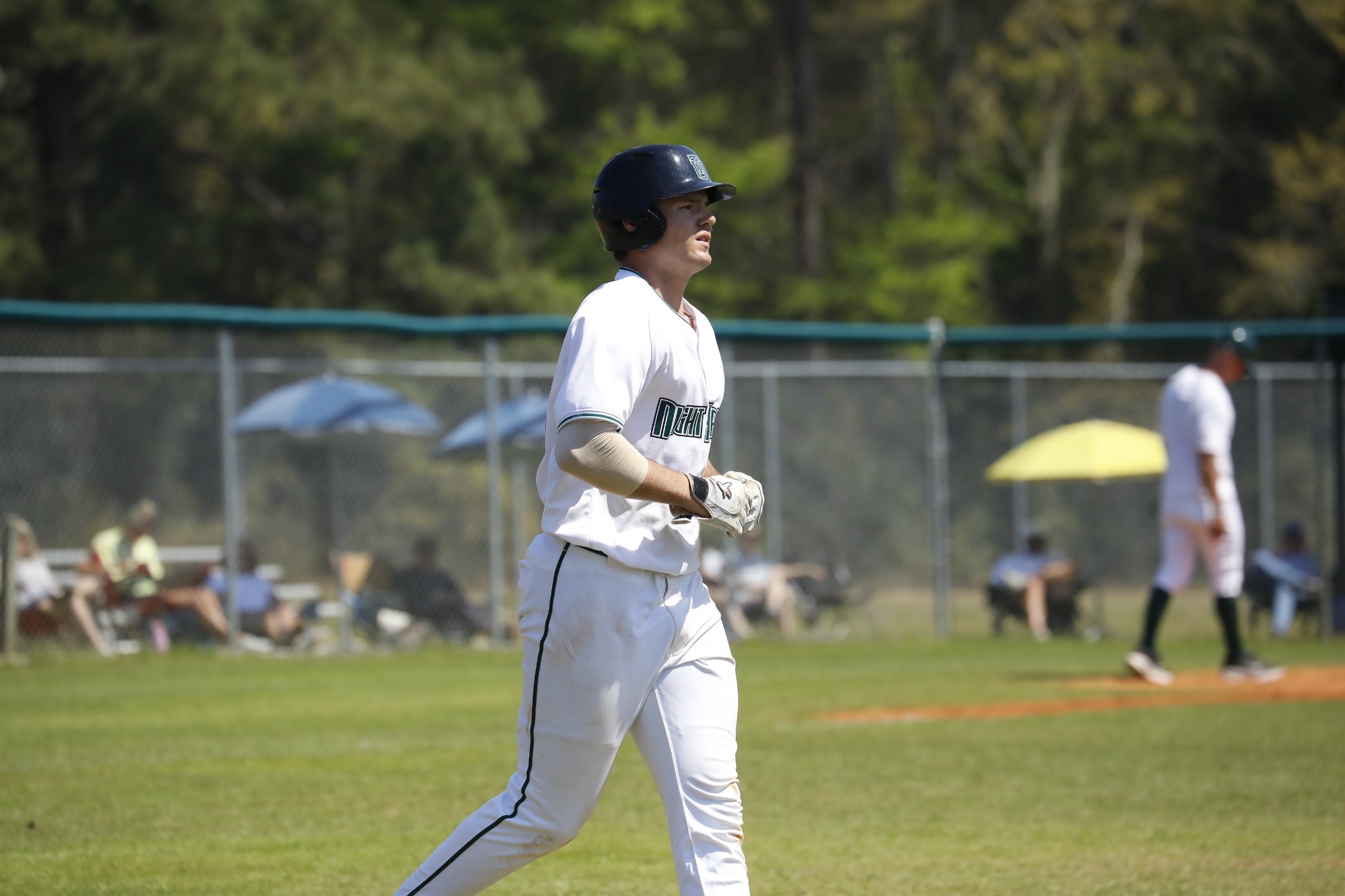 Carson Thomas runs to first