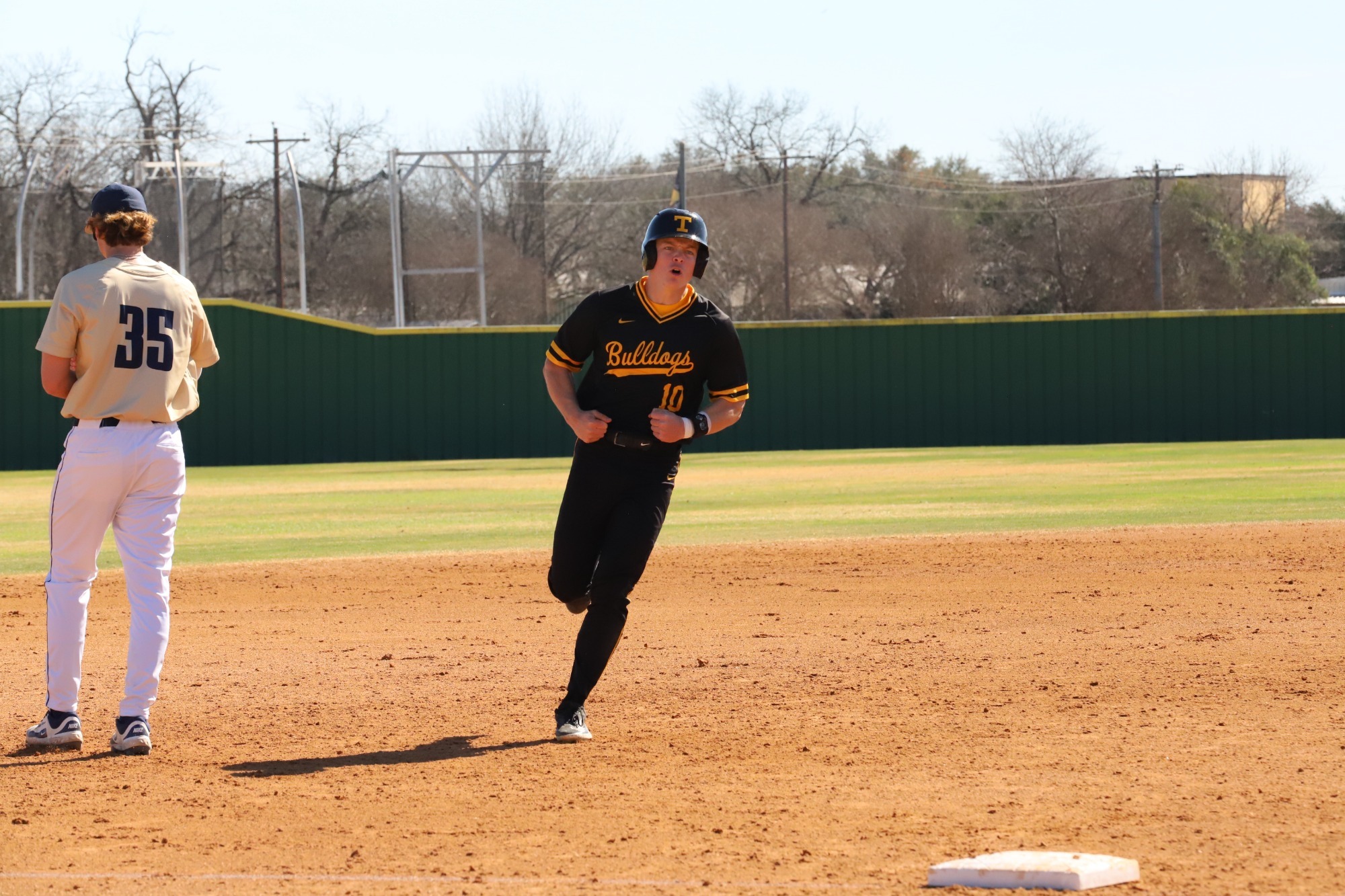 Caleb Small celebrates rounding third