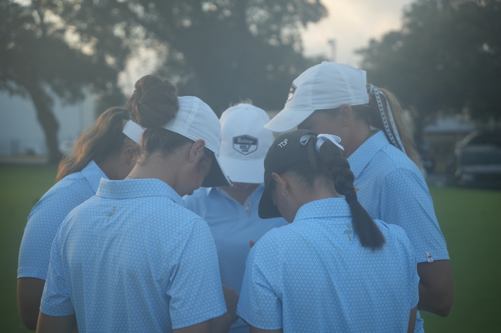 Women's golf huddle