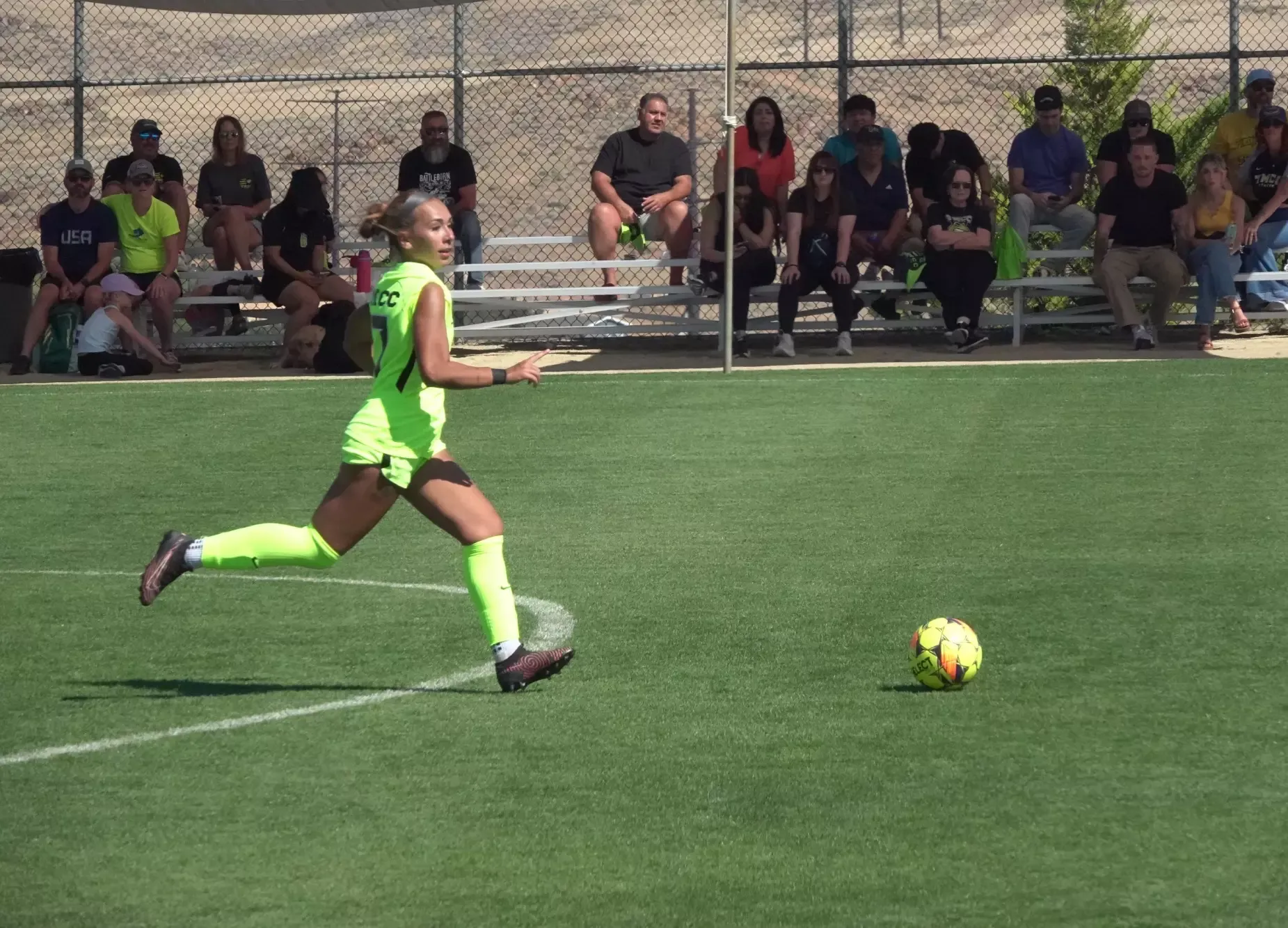 Women's Soccer player Neveah Scorza prepares to kick soccer ball