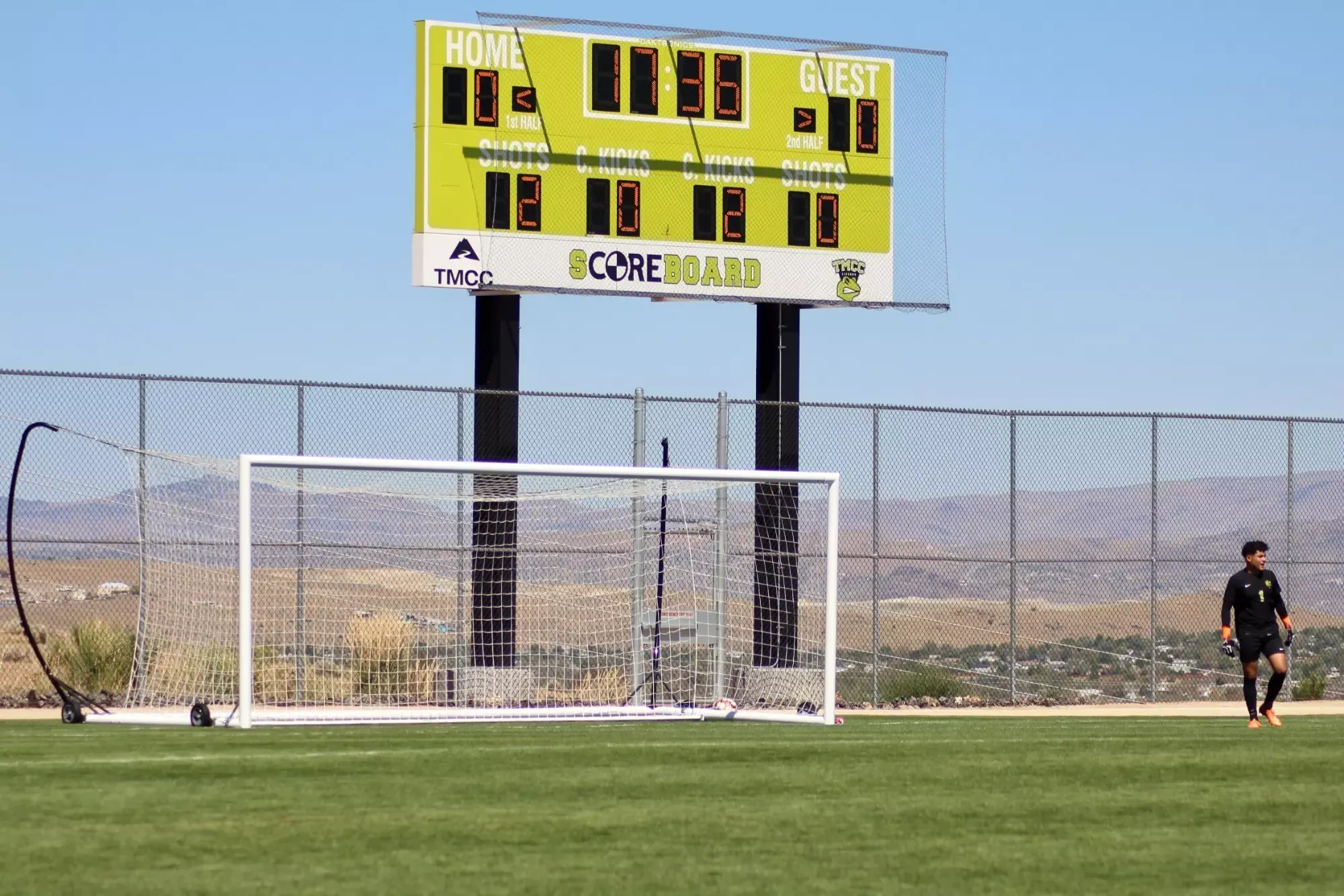 Soccer field scoreboard with goal
