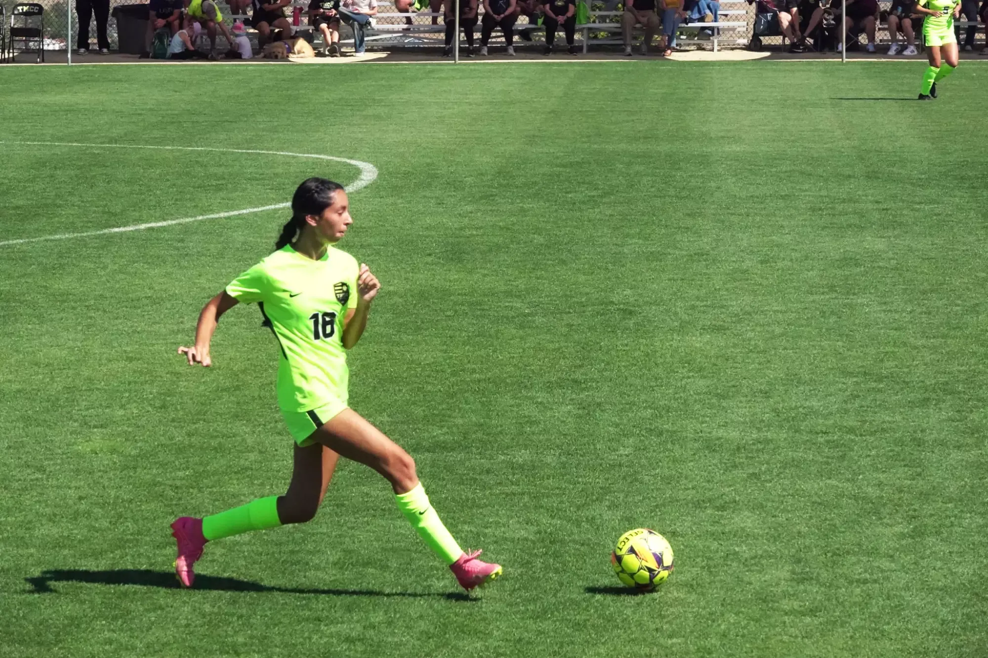 Women's Soccer player Isis Melendez readying to kick soccer ball