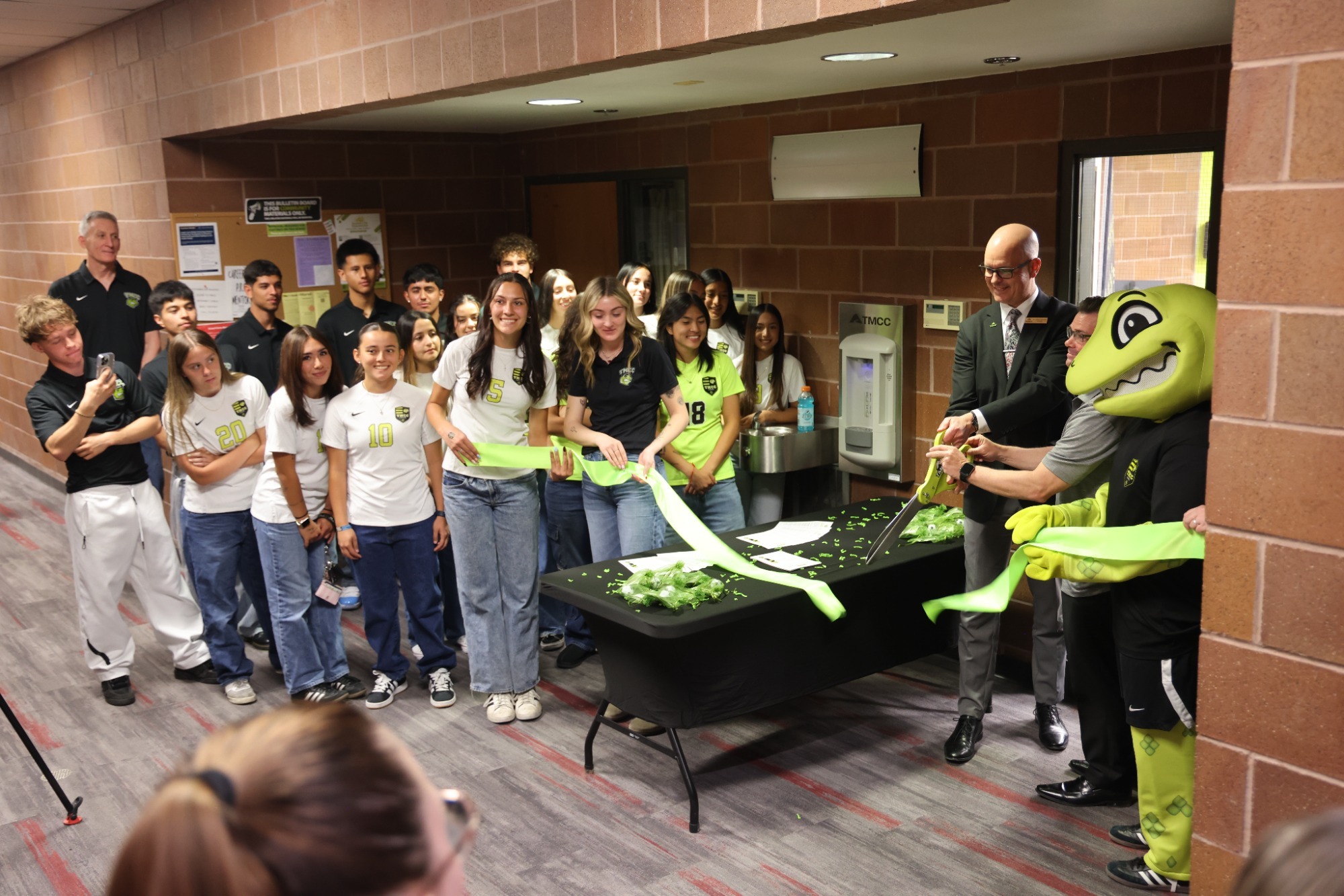 Coaches, Student-athletes, and tmcc leadership gathered for the ribbon cutting event 
