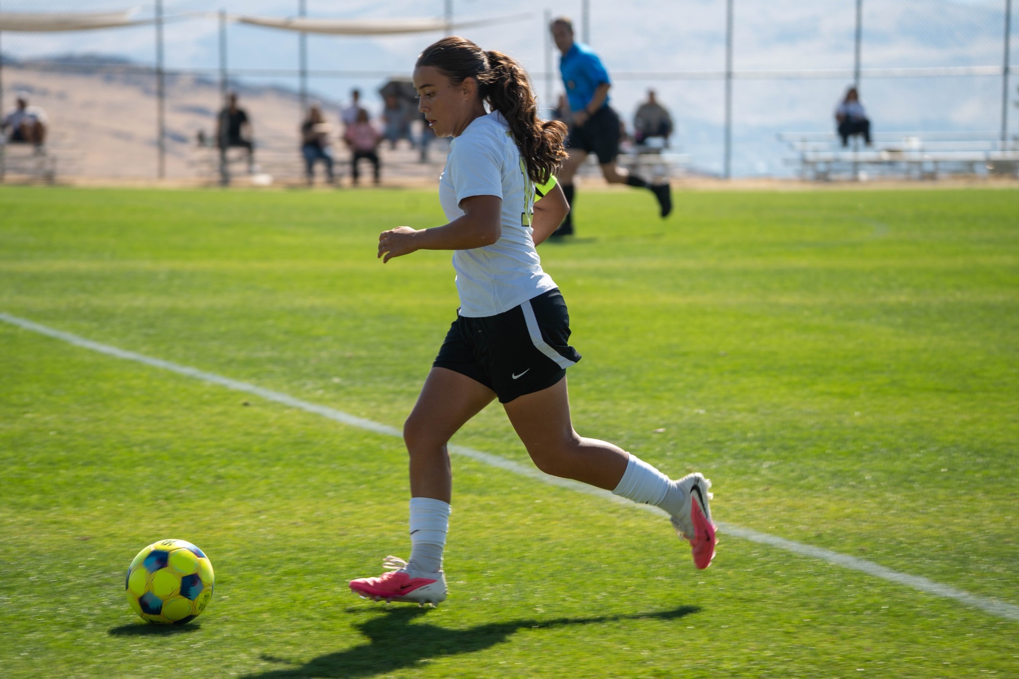 Alondra Carrillo drives down the field