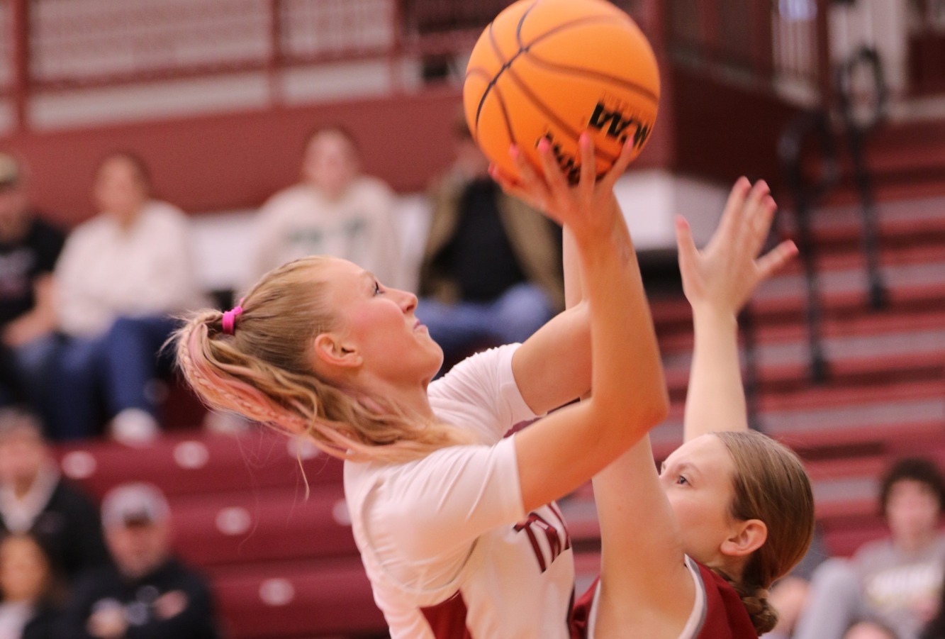 Riley Flinn (#4) scores against Rose-Hulman