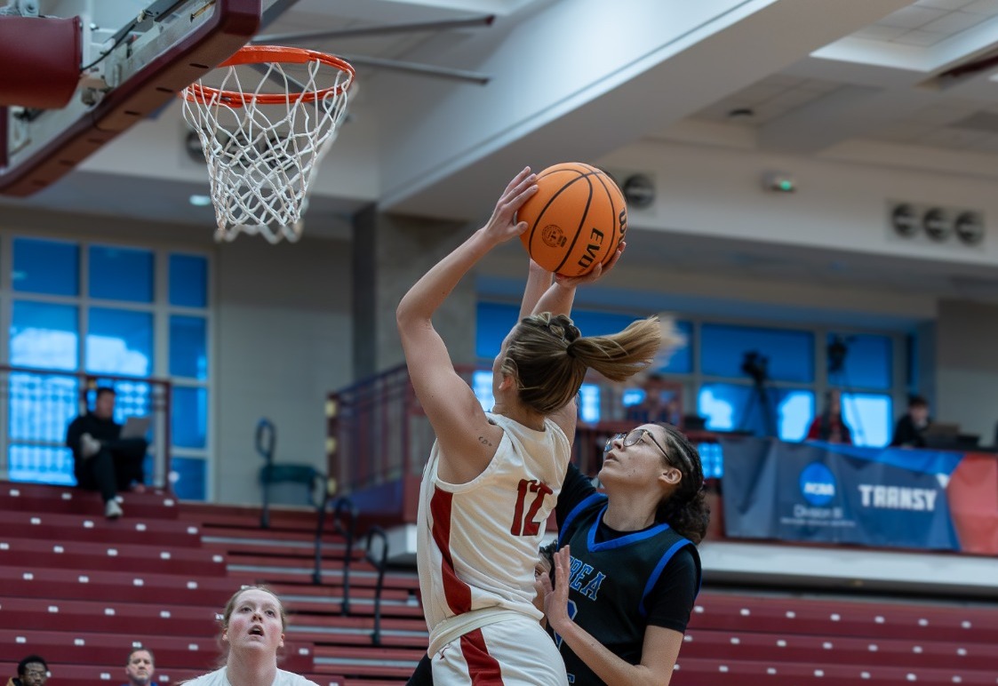 Sierra Kemelgor (#12) rises for a post field goal against Berea. 