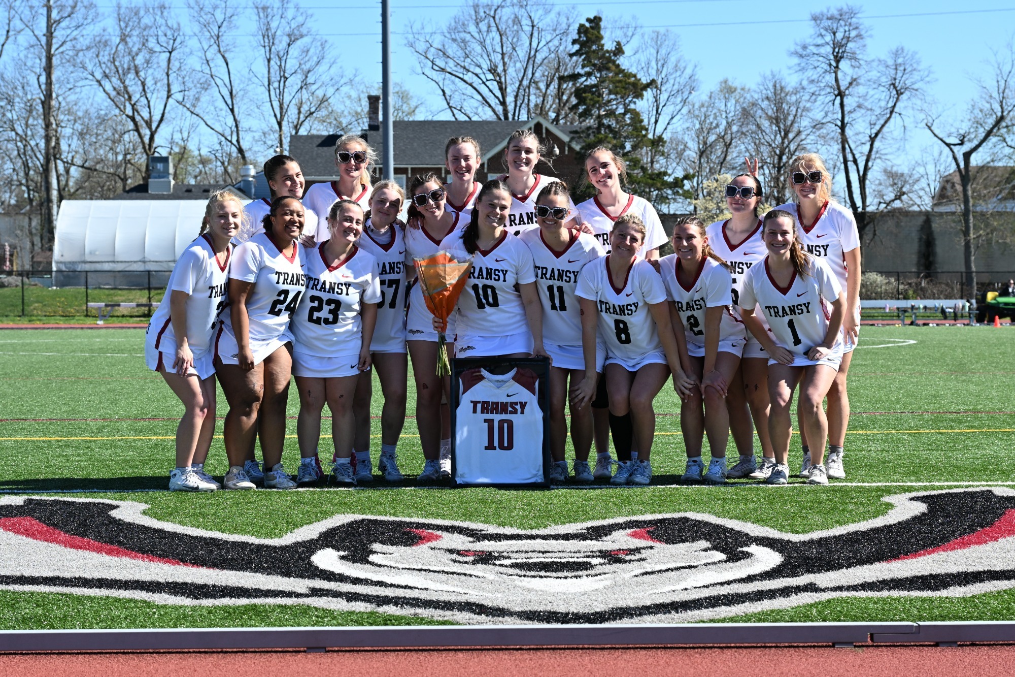 Jayden Otto (#10) is celebrated with teammates and coaches on senior day at Pat Deacon Stadium