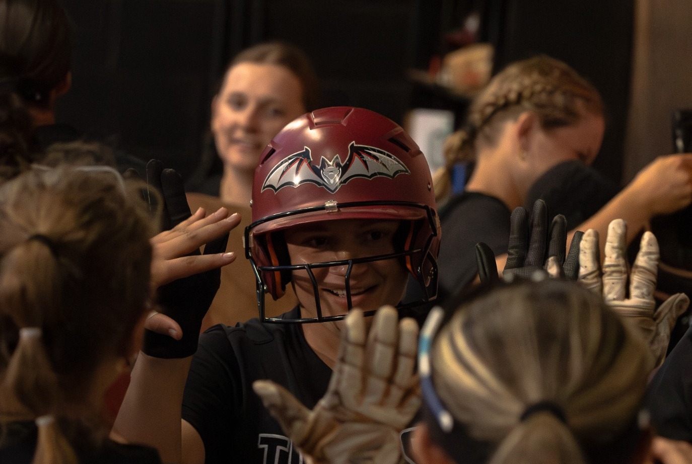 Transylvania celebrates in the dug out after a run to extend their lead over Asbury.