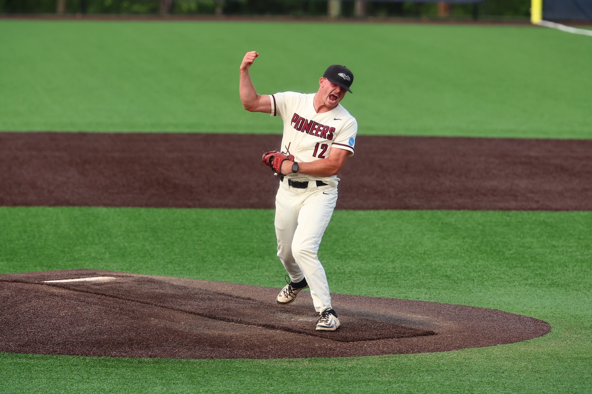Drew Bowles (#12) celebrates the Pioneer victory in the NCAA Regional. 