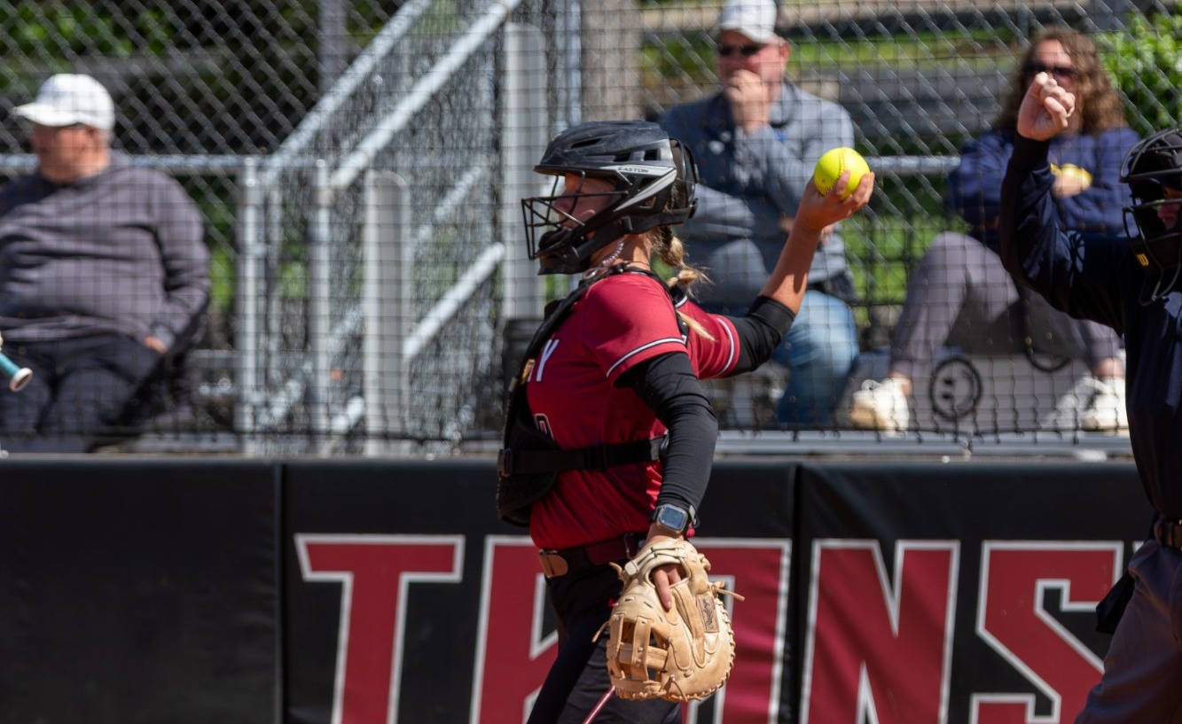 Emilie Young (#10) throws the ball back to the mound during Transylvania's victory over Manchester. 