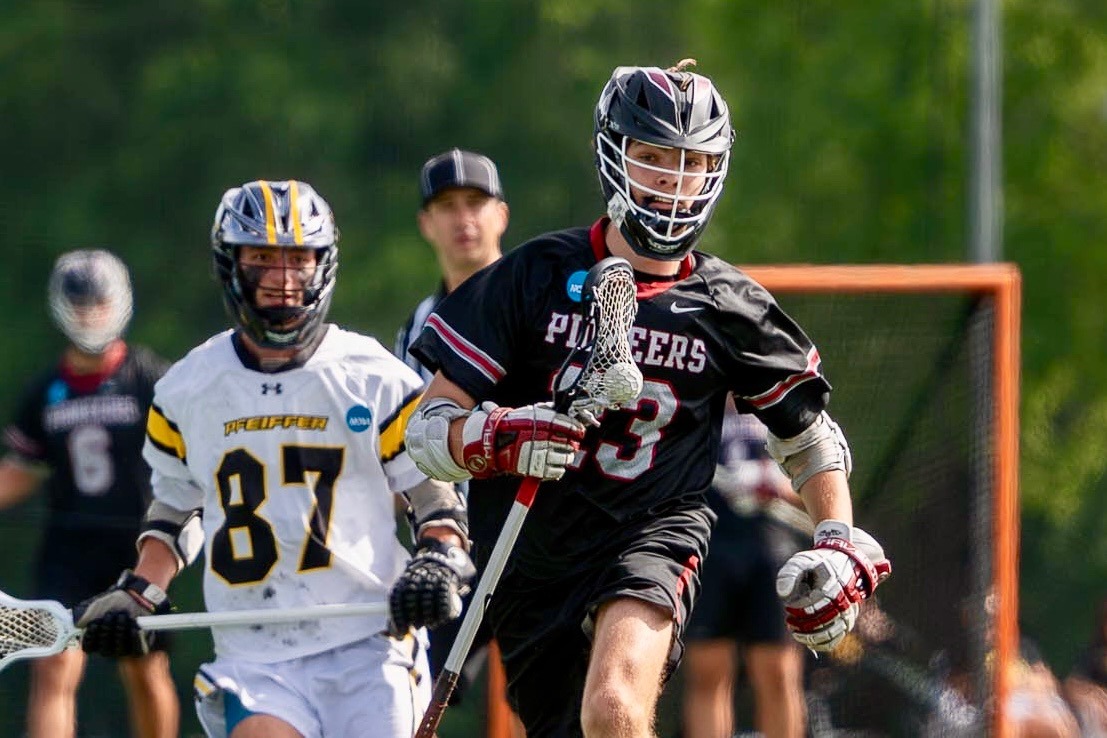 Tommy Scales (#23) attacks the Pfeiffer defense in Wednesday's NCAA opener. 