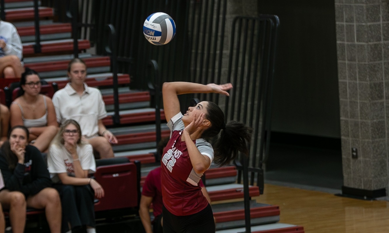 Cecelia Roberts (#22) serves in Transylvania's match with Centre College. 