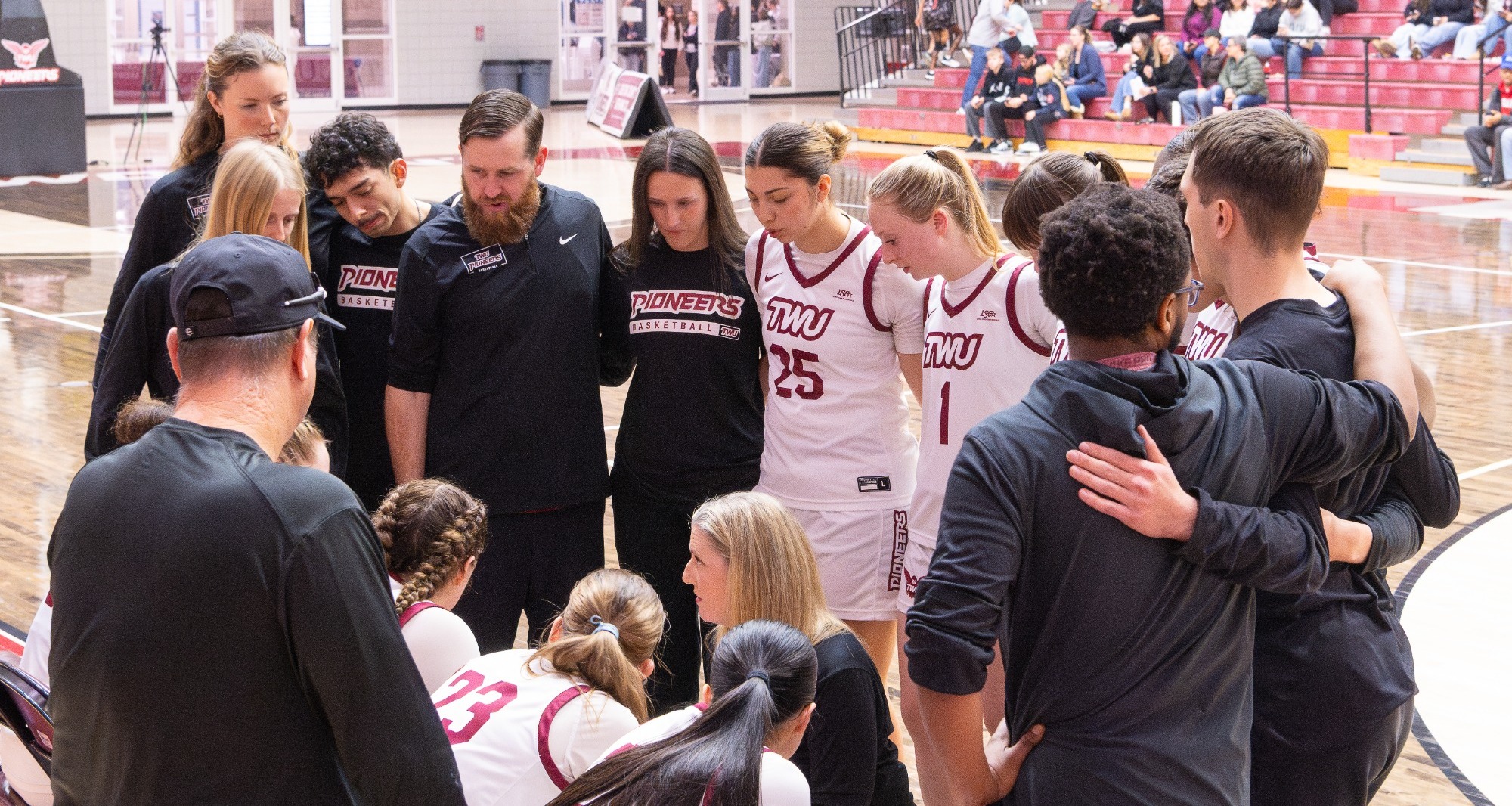 twu basketball team huddle vs. midwestern state