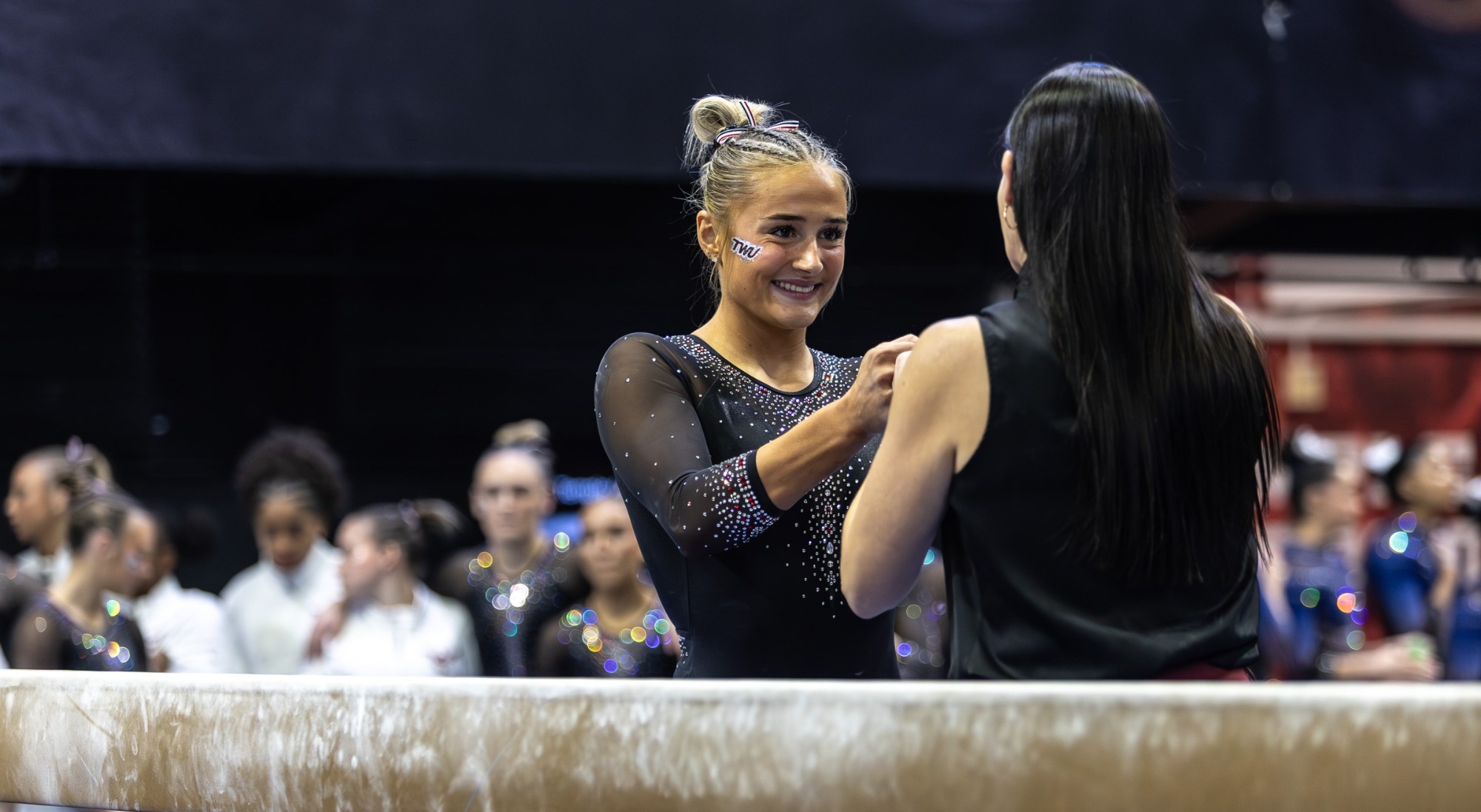 isbell smiles at beam at temple