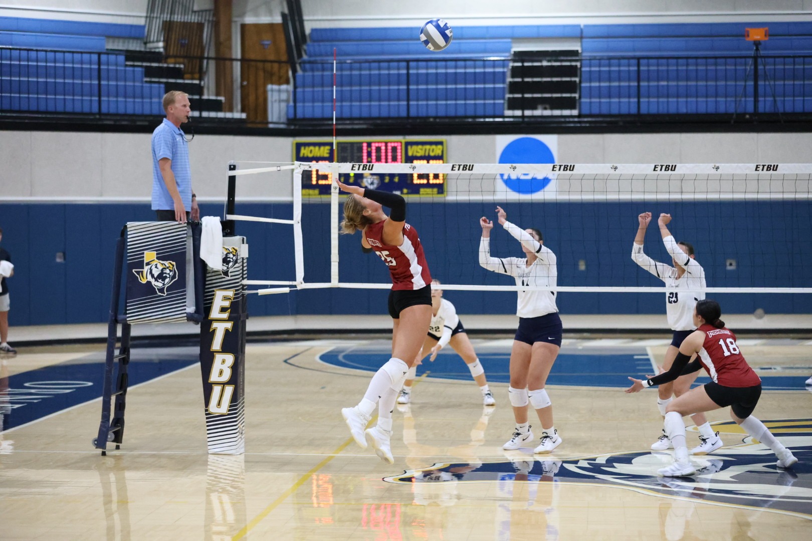 Mary Grace King goes to hit the ball over the net. 
