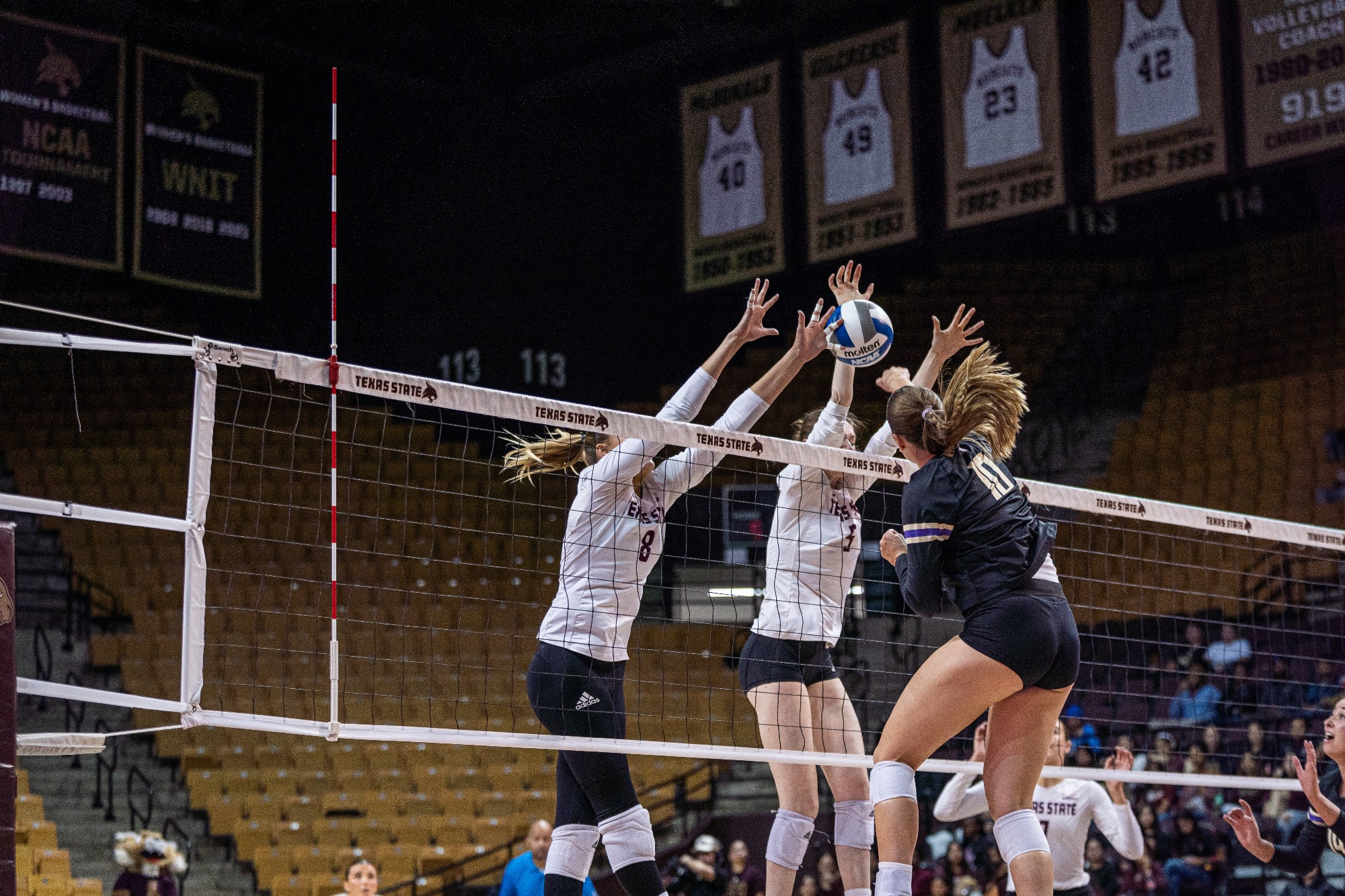 Sam Wunsch and Jade Defraeye go for a block.
