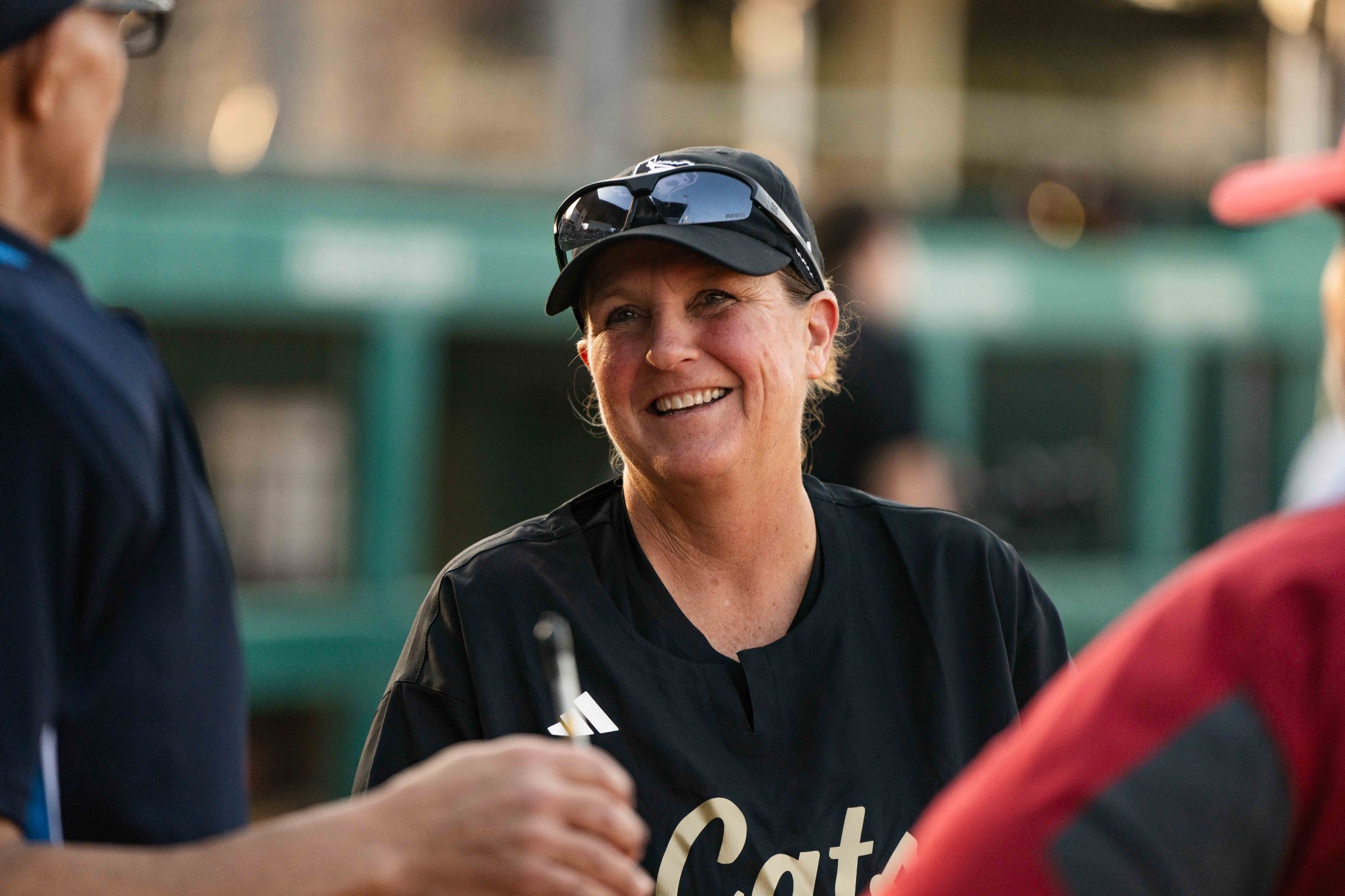 Coach Ricci Woodard Talks with Arkansas' coach and the umpire pregame.