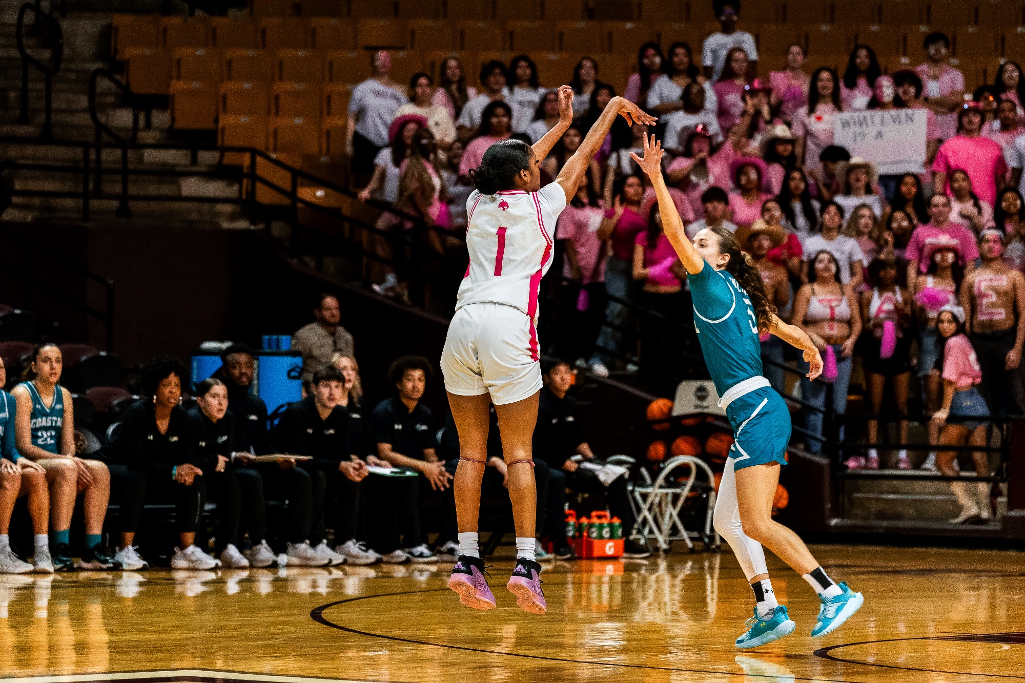 Saniya Burks shoots a three pointer.