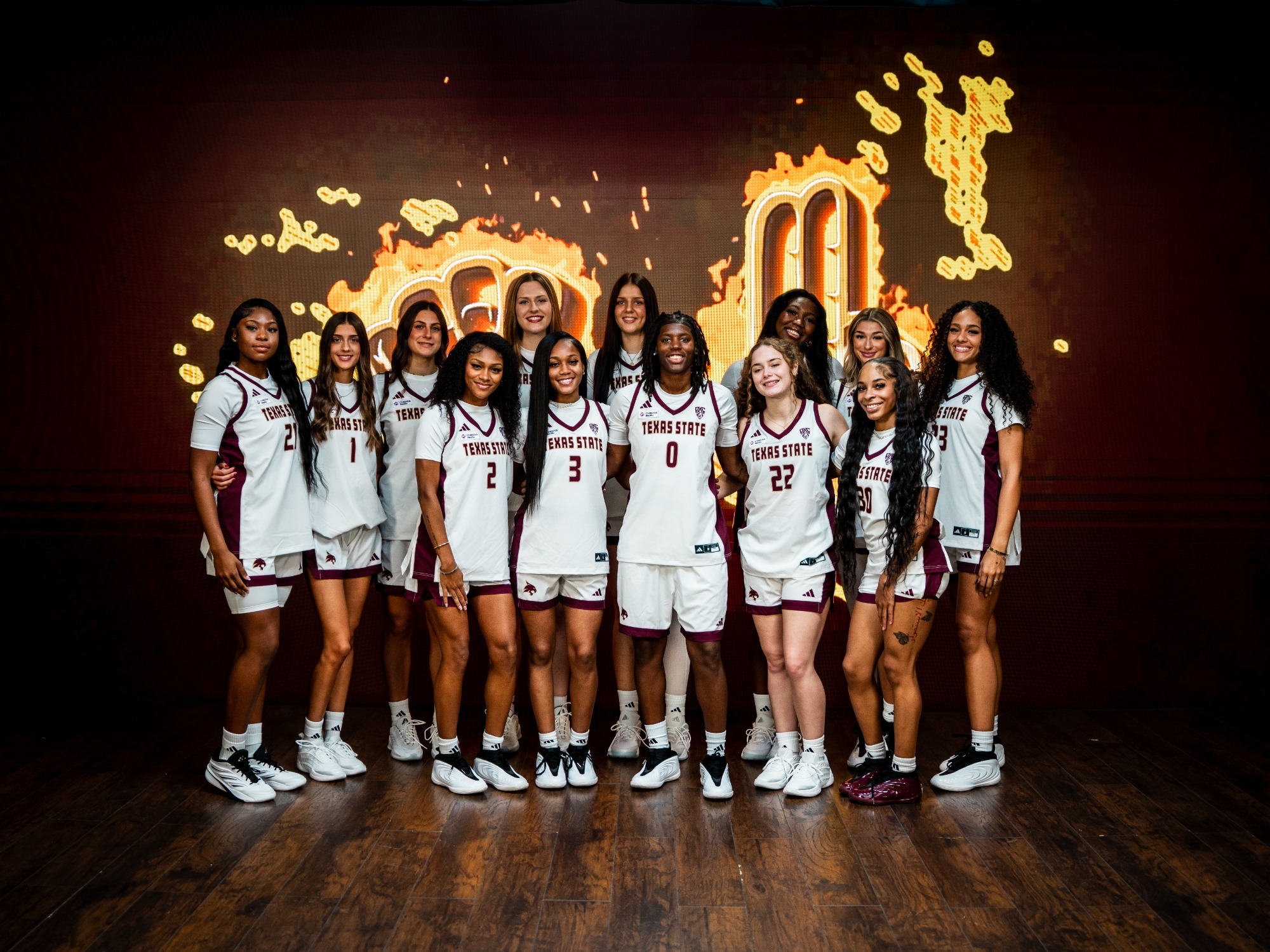 Team Photo in front of Alkek videoboard