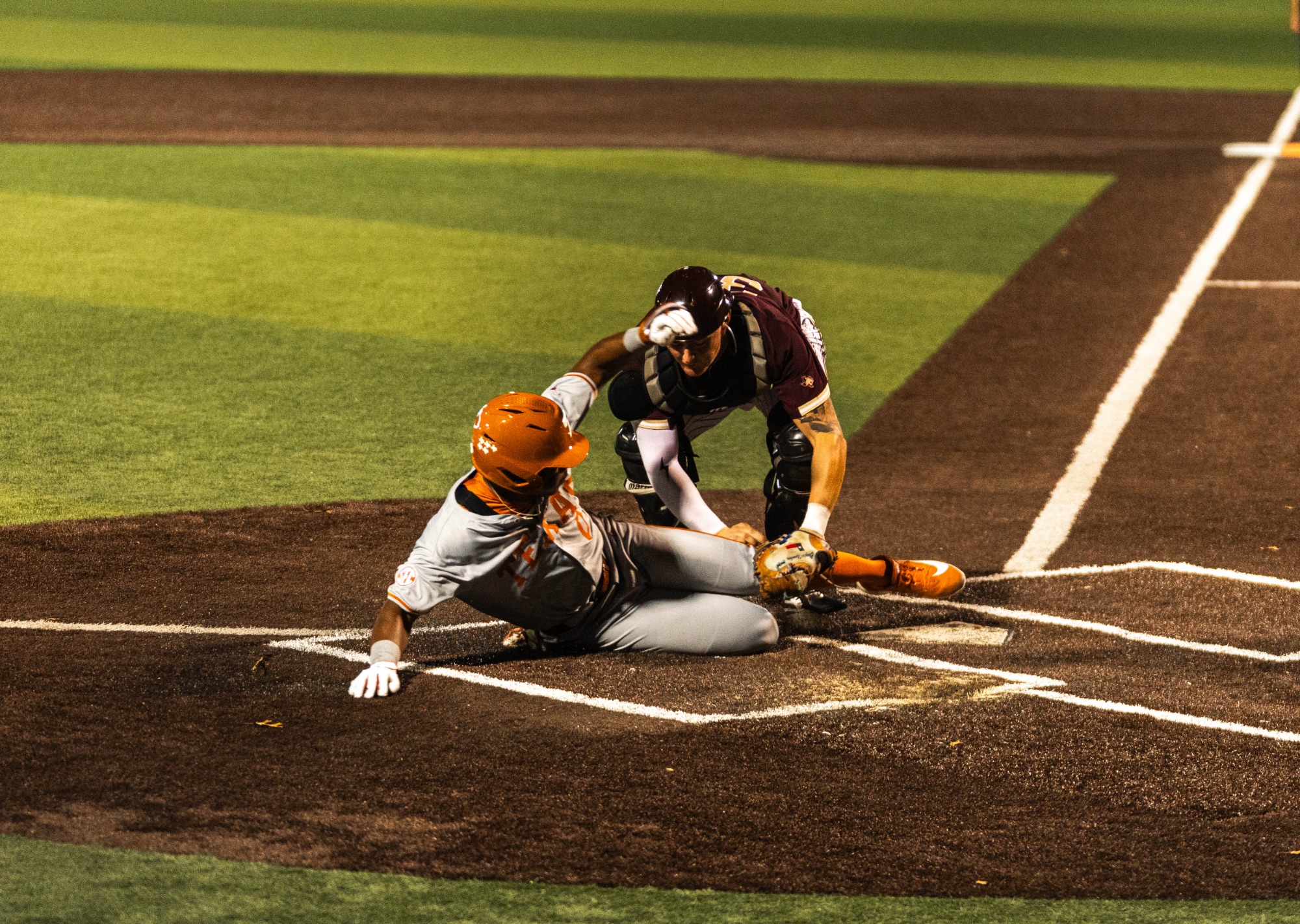 Clayton Namken tagging out Texas runner at the plate