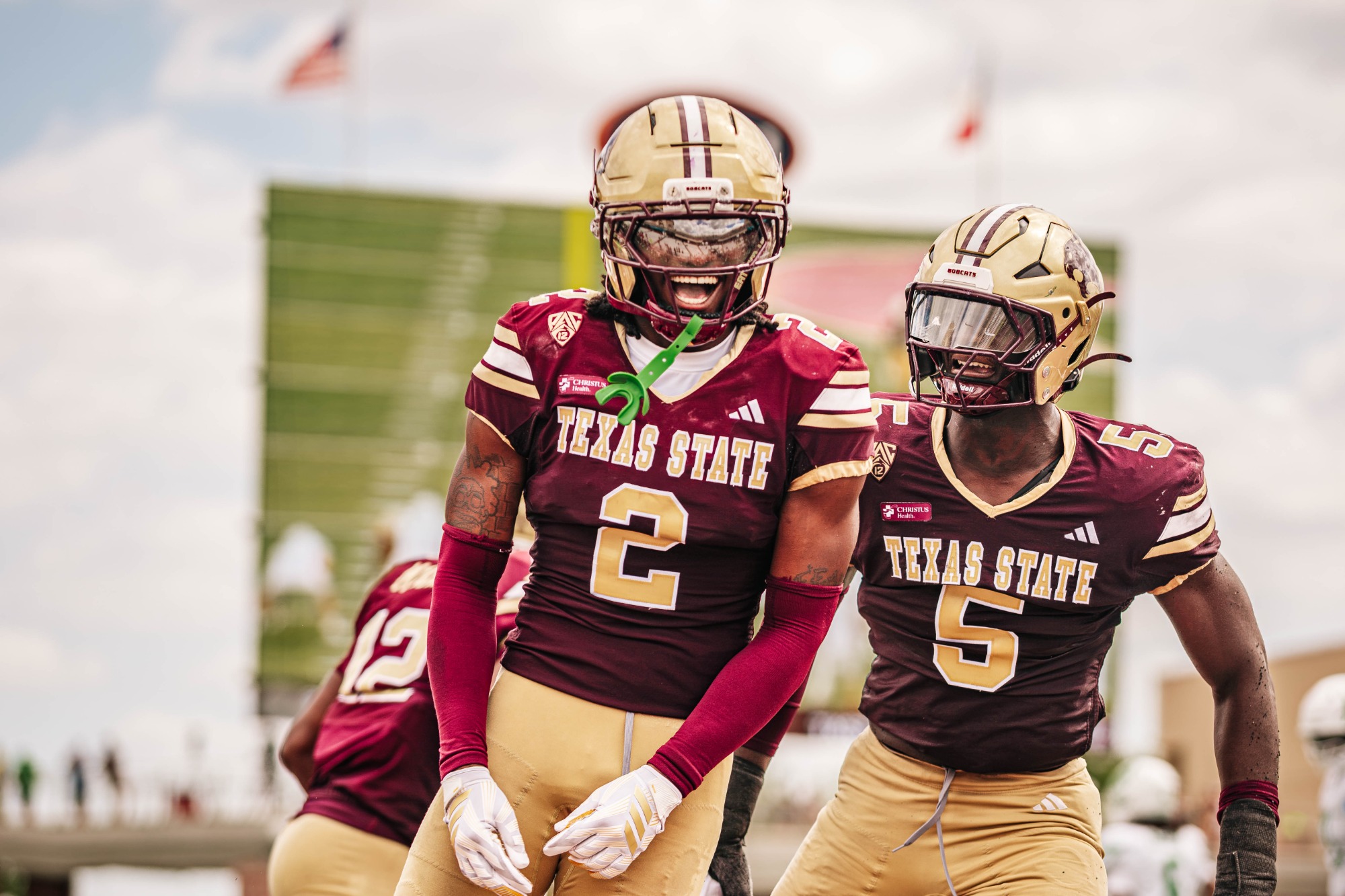 Texas State Football Players Celebrate Against North Texas