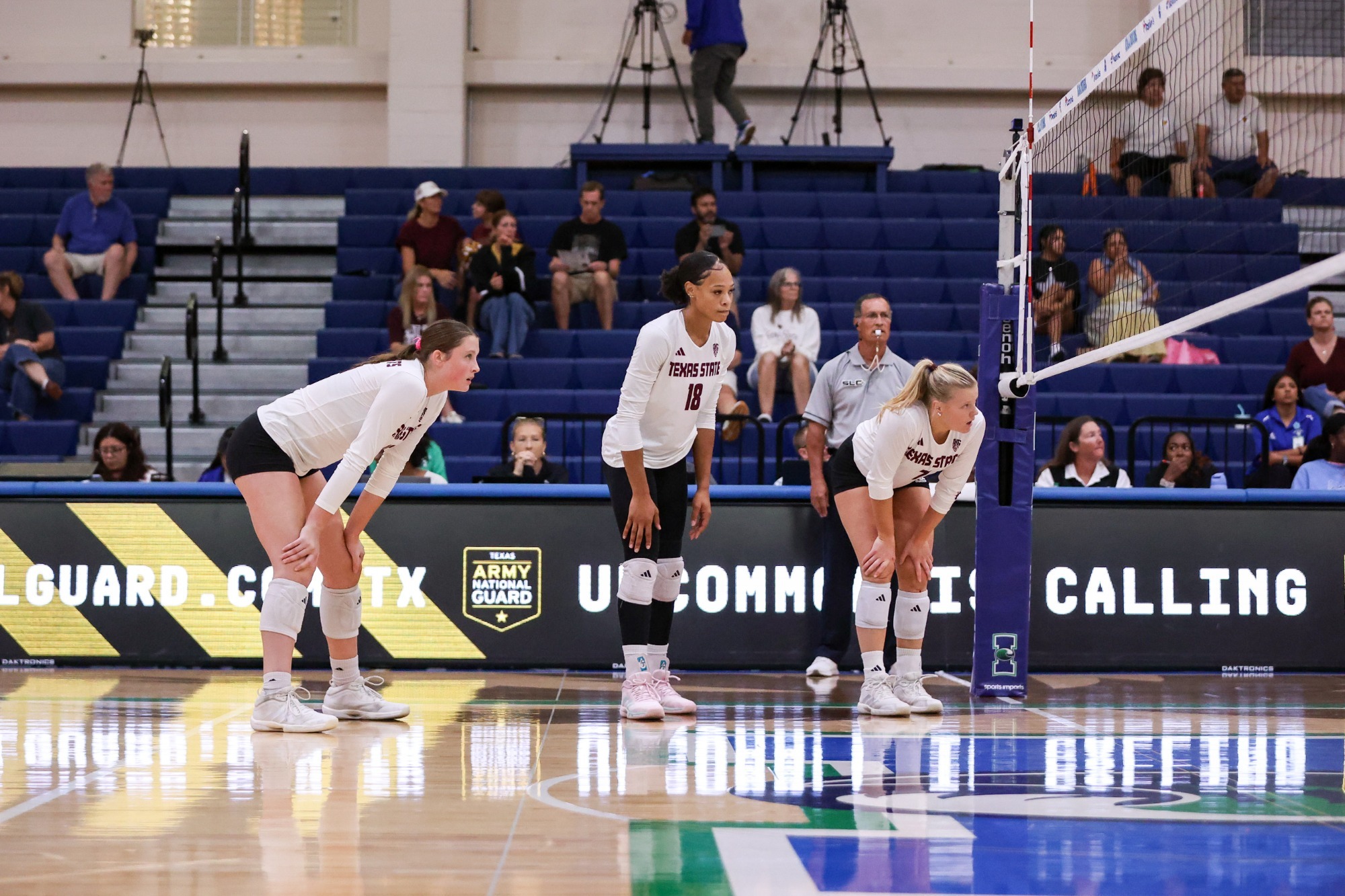India Bennett, Caelyn Robel, and Dylan Gilkey prepare for the UTRGV serve