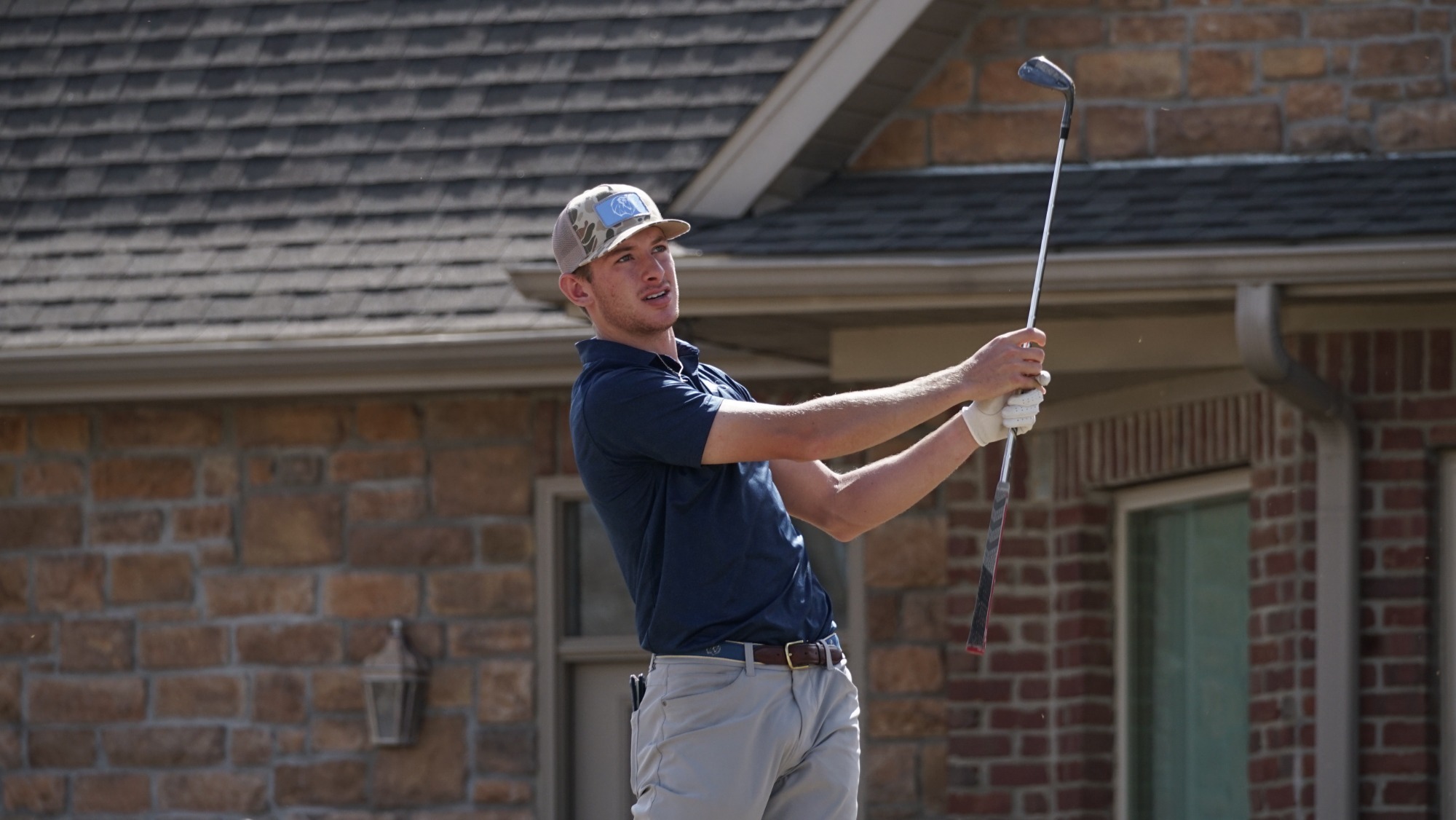 A UAFS golfer takes a swing in a tournament. 