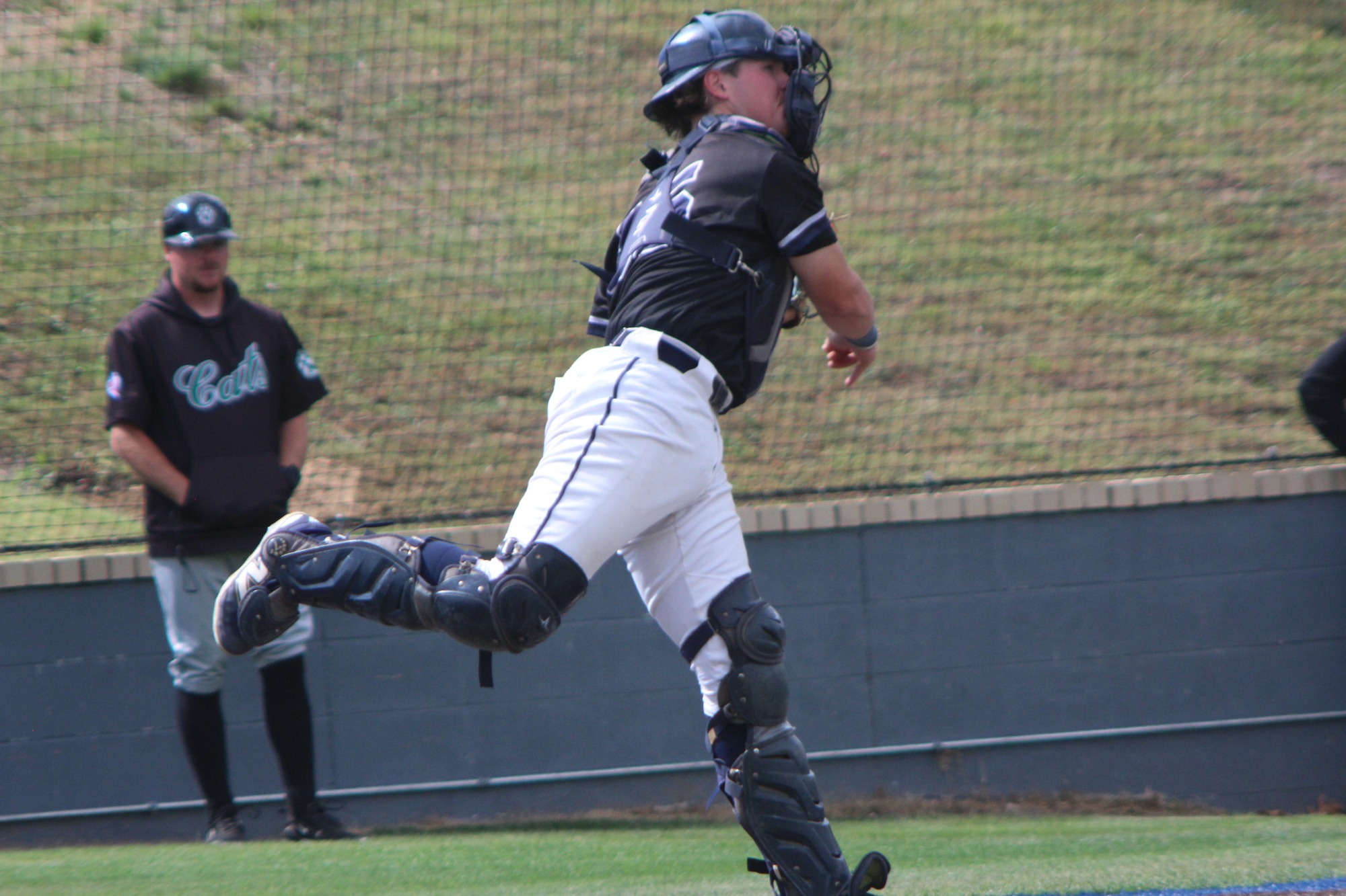 A catcher throws the ball. 