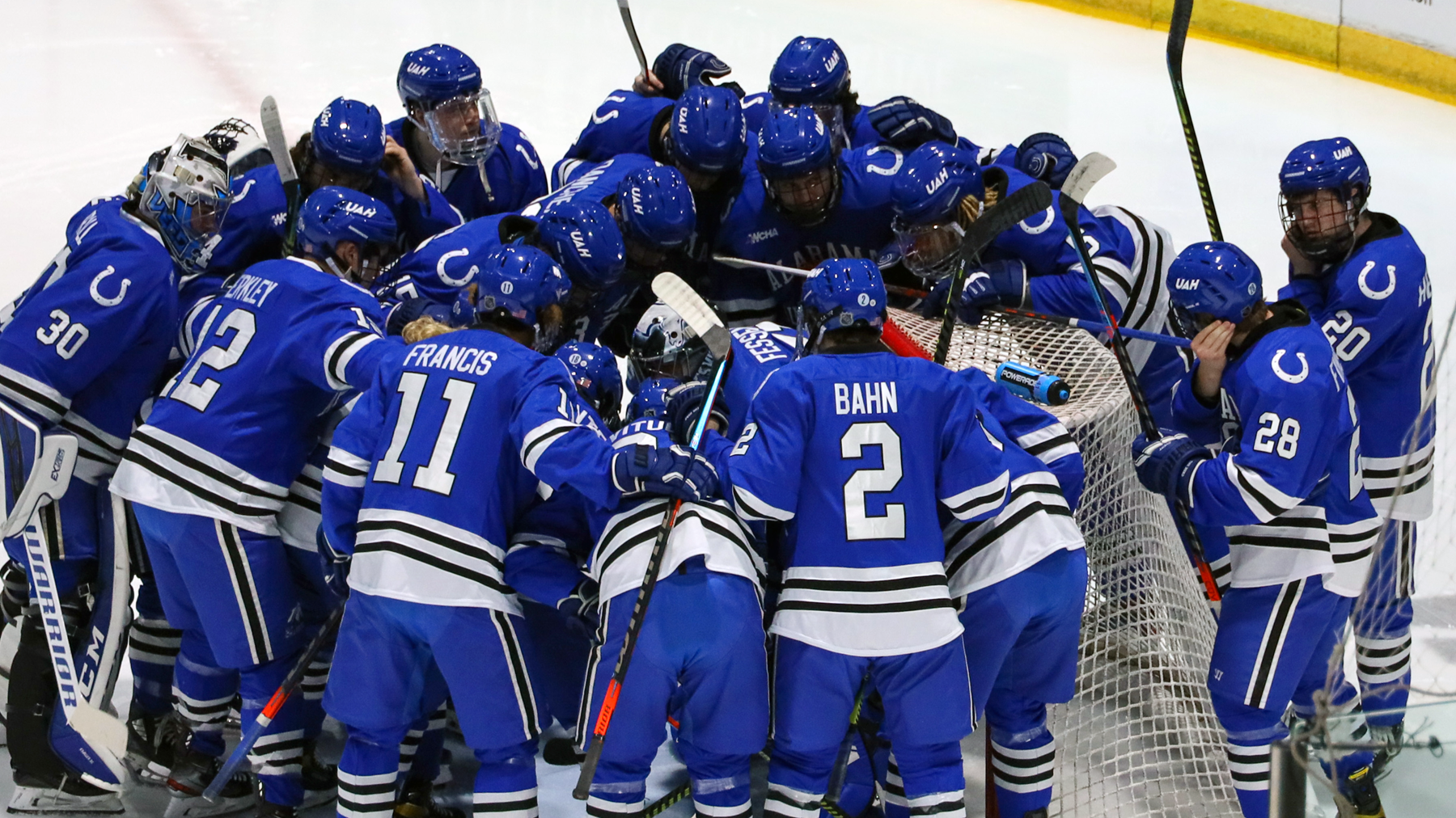 UAH team prior to a game at Lake Superior State, wearing blue jerseys and blue pants