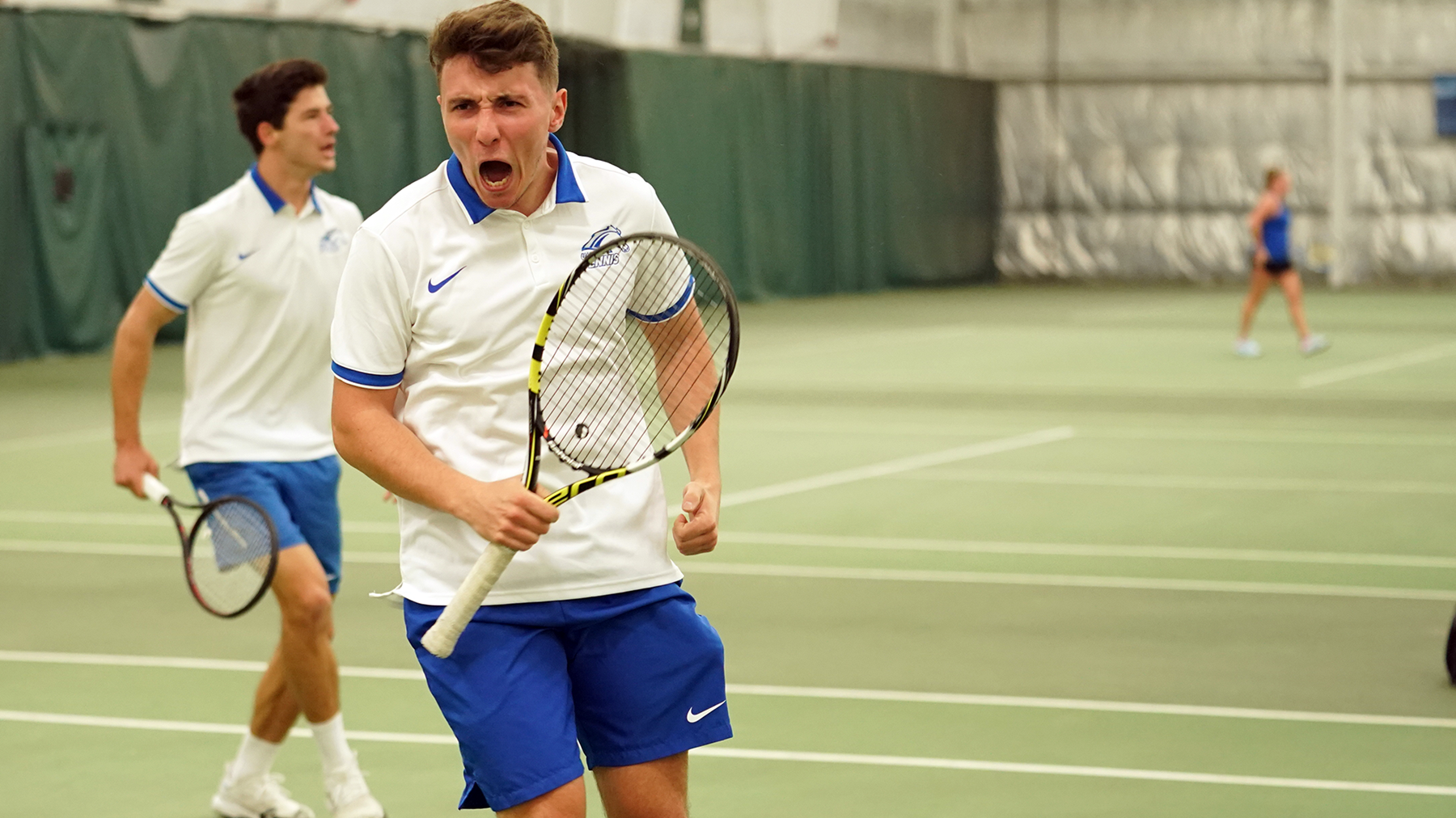 Tim Nutz celebrates a point in a recent tennis match.