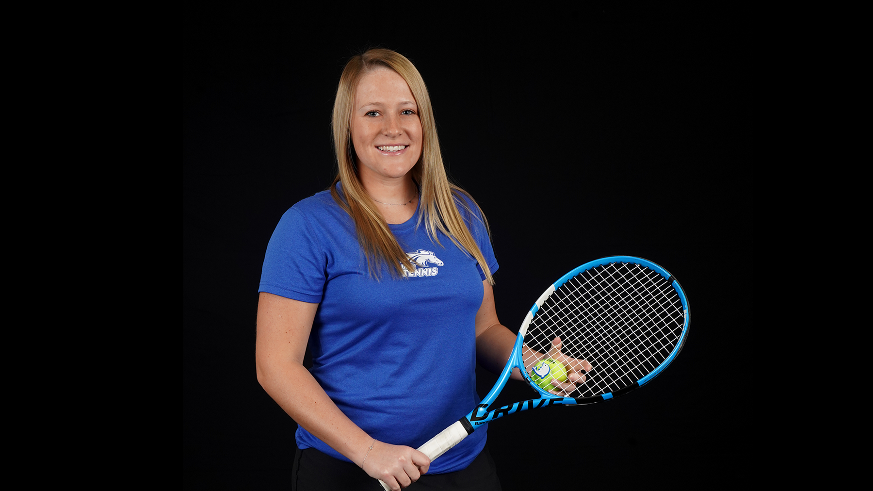 Presley Thomas is pictured holding a racket.