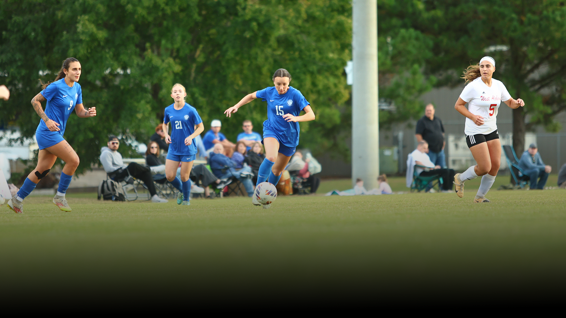Carlee White dribbling the ball downfield