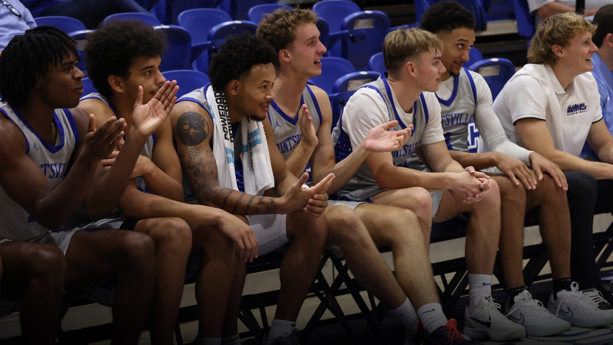 Men's basketball team on bench