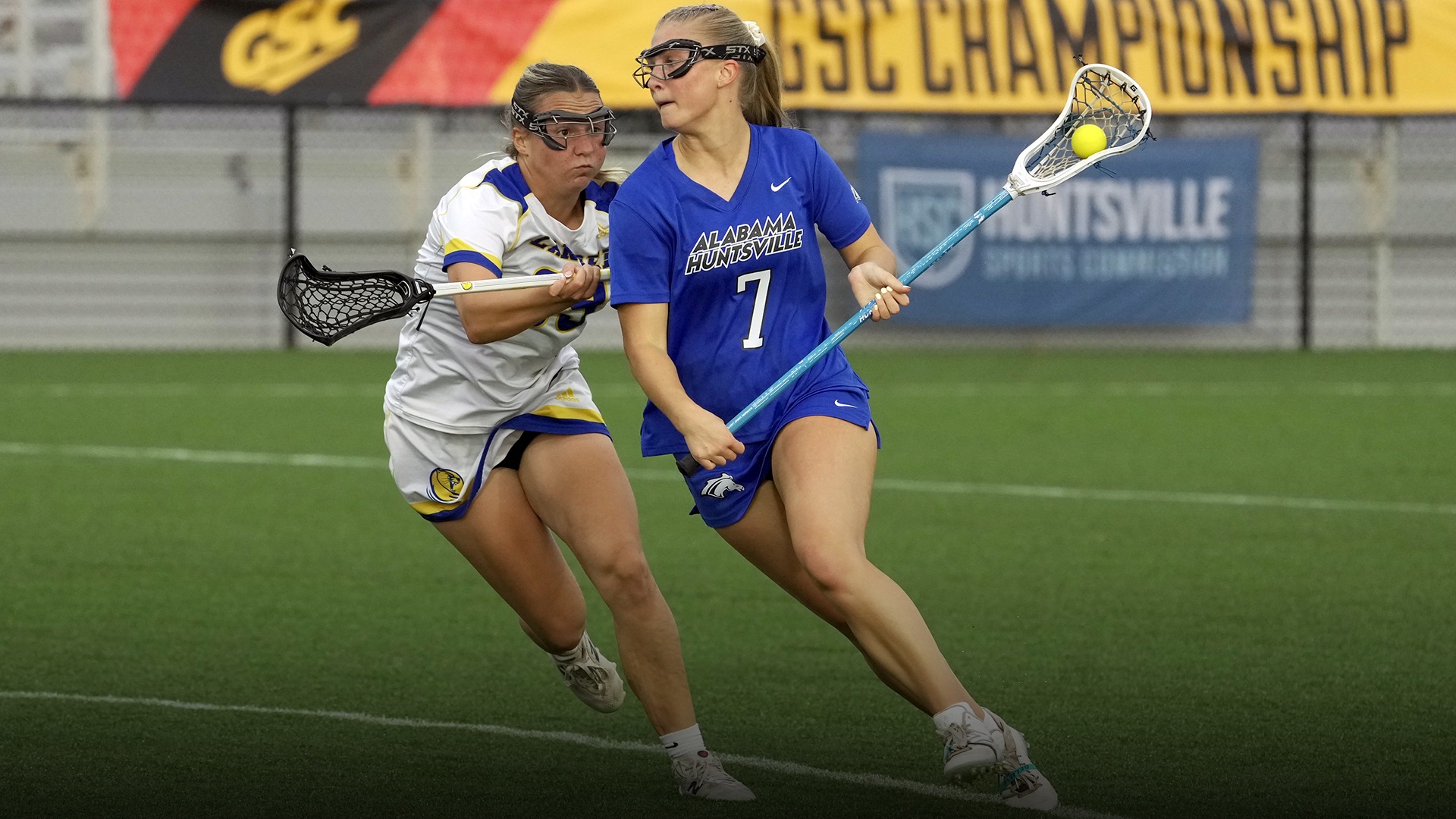 Ella Rutherford running with the ball at GSC tournament in a blue uniform