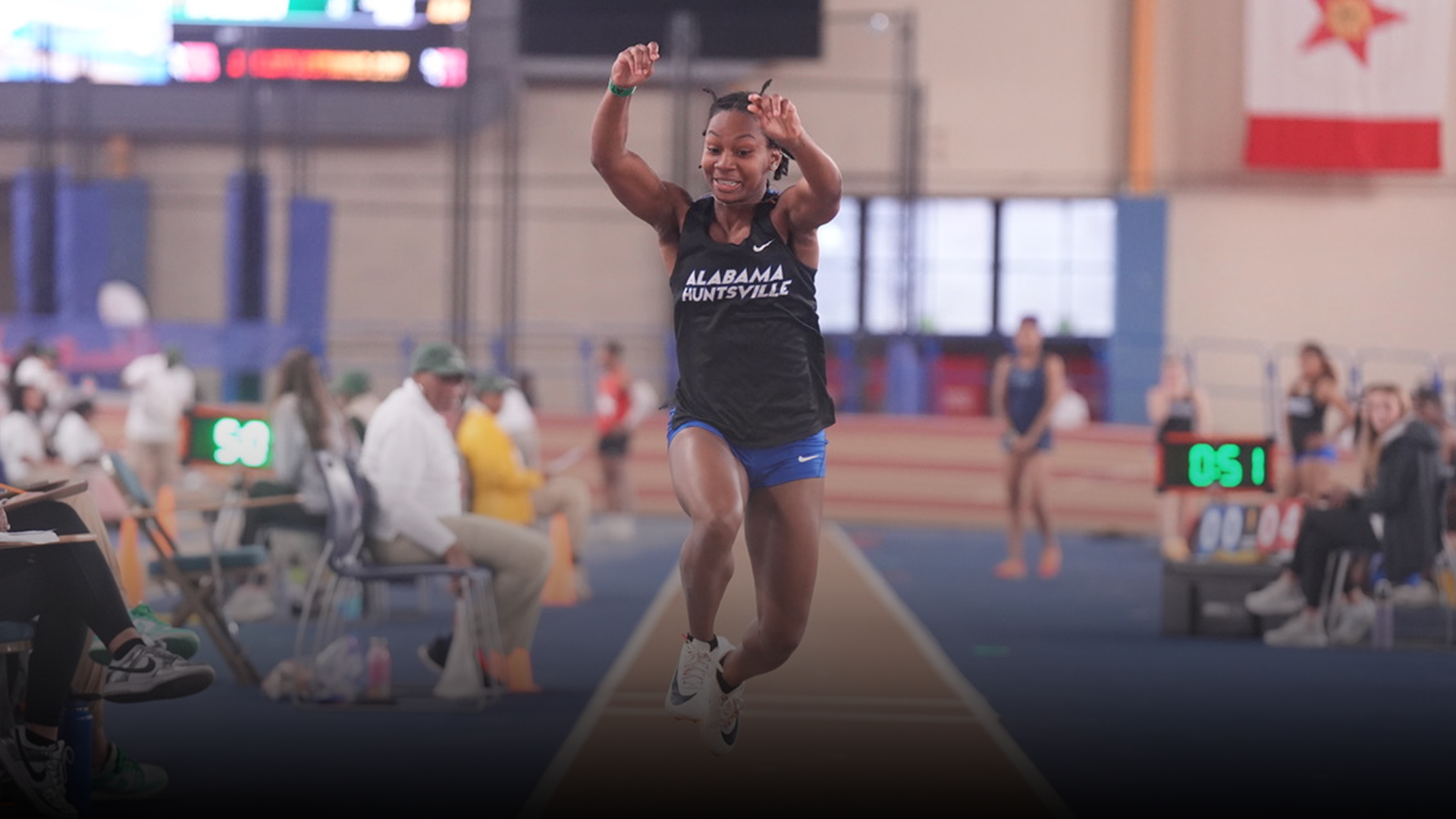 Jadlyn Debardlabon competing in the long jump