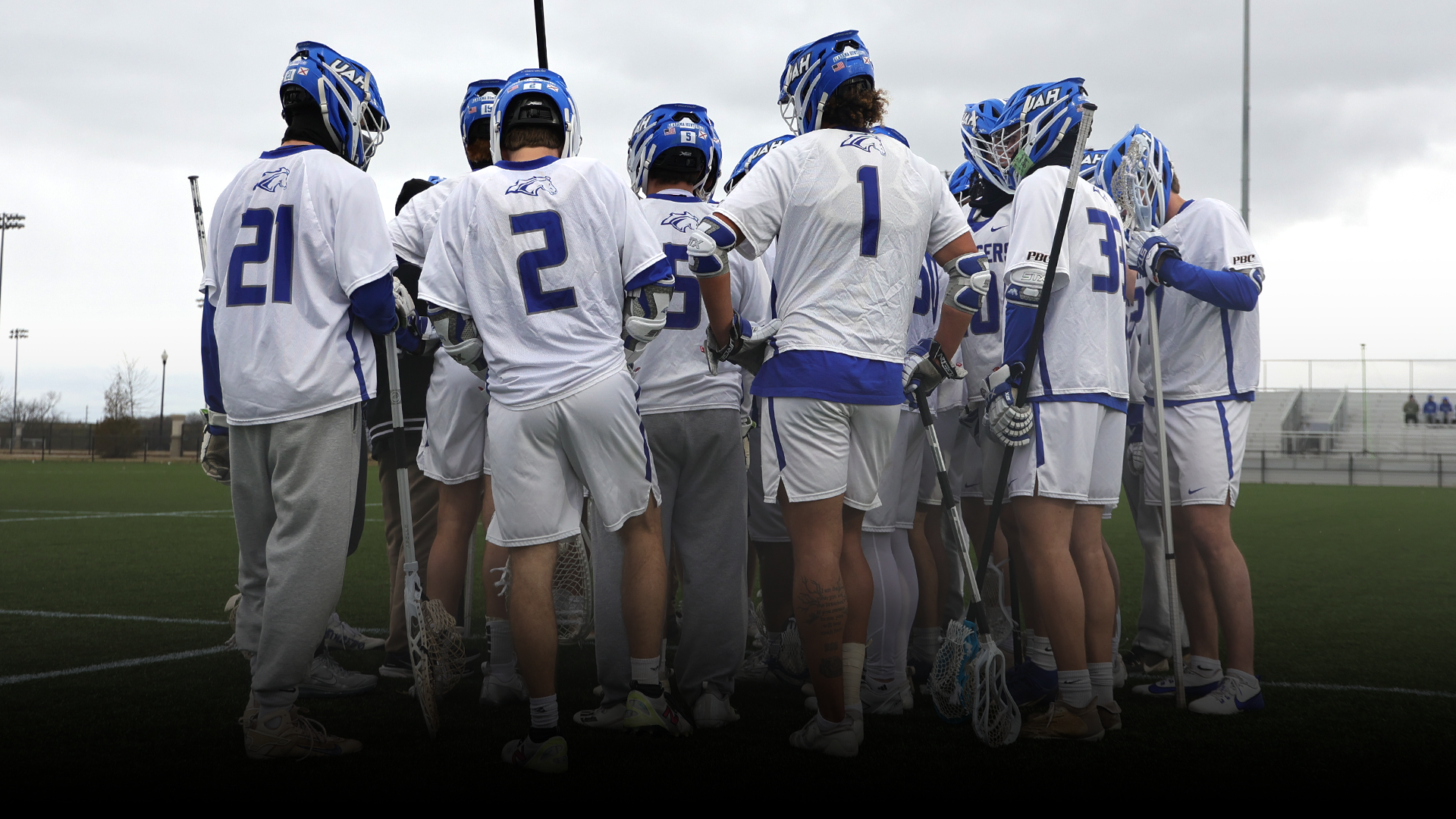 Men's Lacrosse Team Huddled Up